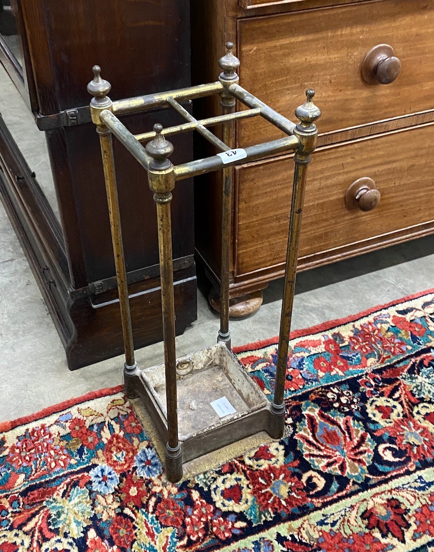 A late Victorian cast iron and brass four division stick stand, height 63cm                                                                                                                                                 