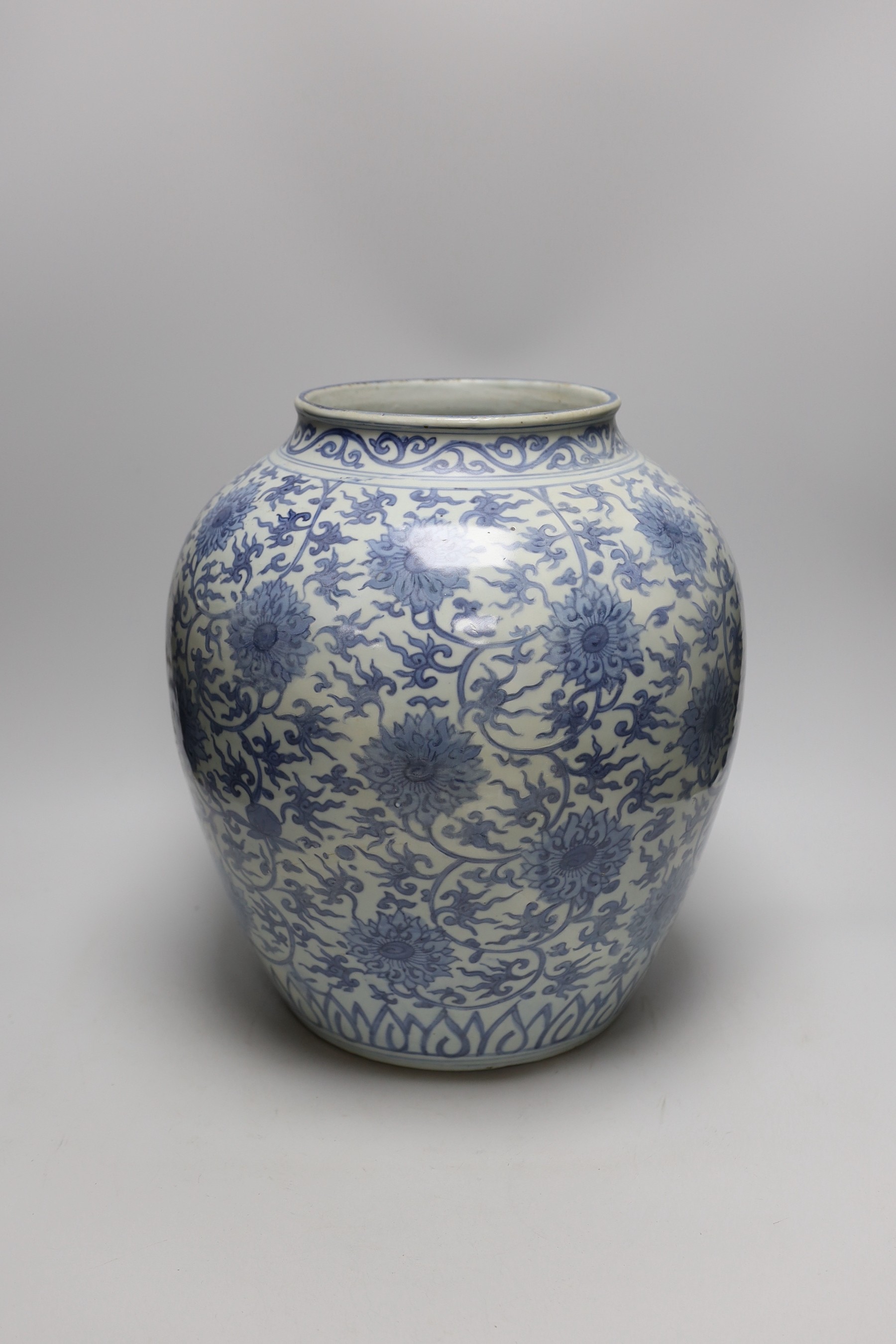 A Chinese blue and white 'lotus' jar, 17th century, 38cms high, restored                                                                                                                                                    