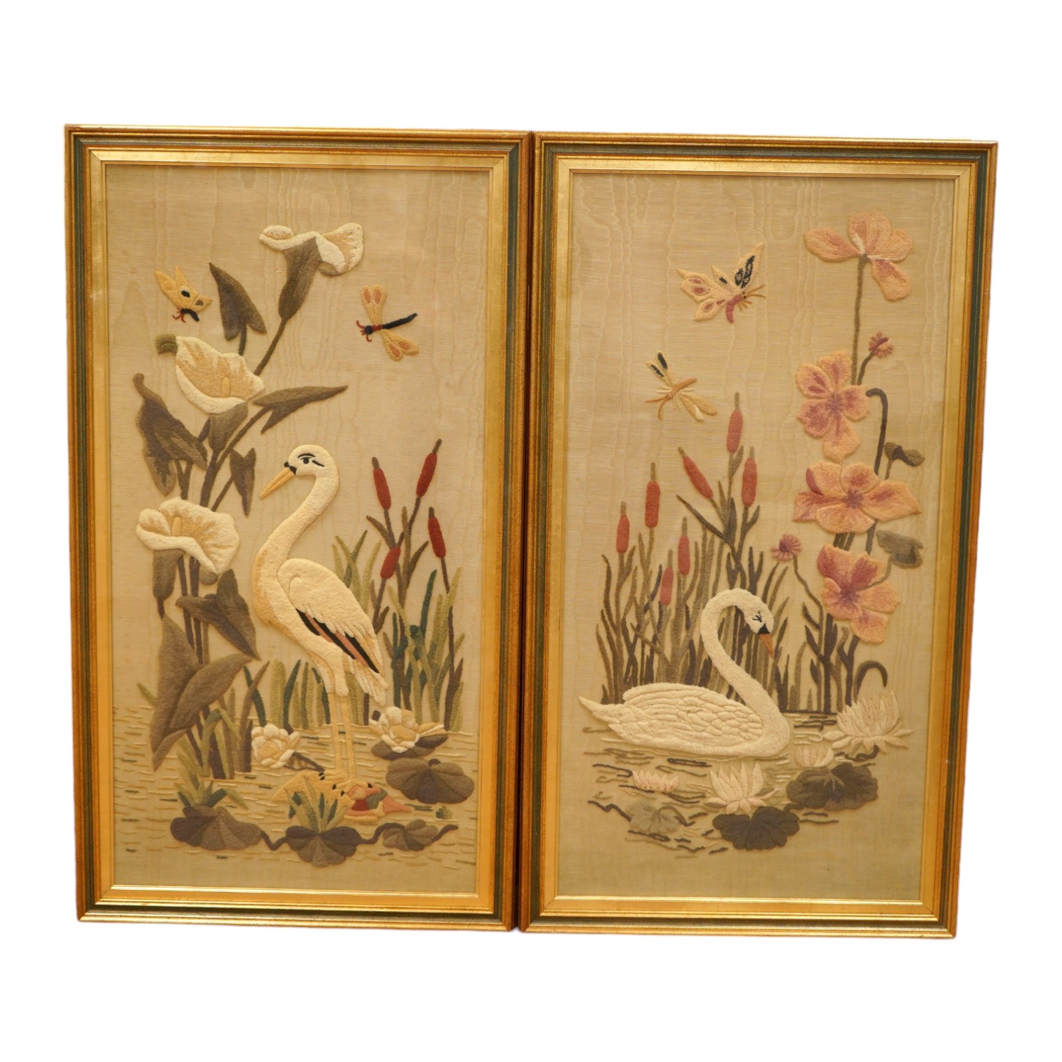 A pair of watered silk and relief felt panels, Birds amongst flowers and insects, 86 x 43cm. Condition - fair                                                                                                               