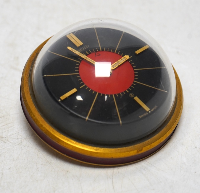 A 1950's/60's Jaeger travelling alarm timepiece, 7cm diameter. Condition - some light surface scratches, otherwise good. Winds, not ticking.                                                                                