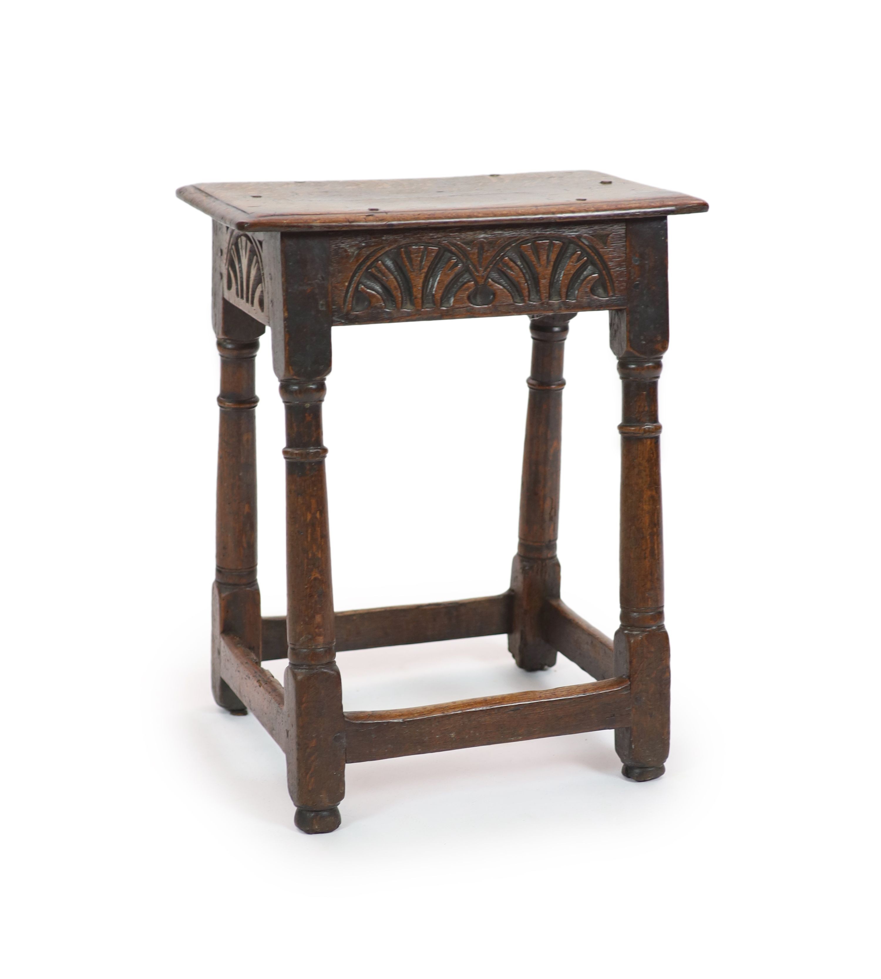 A Charles II oak joint stool, H 57cm. W 46cm. D 34cm.                                                                                                                                                                       