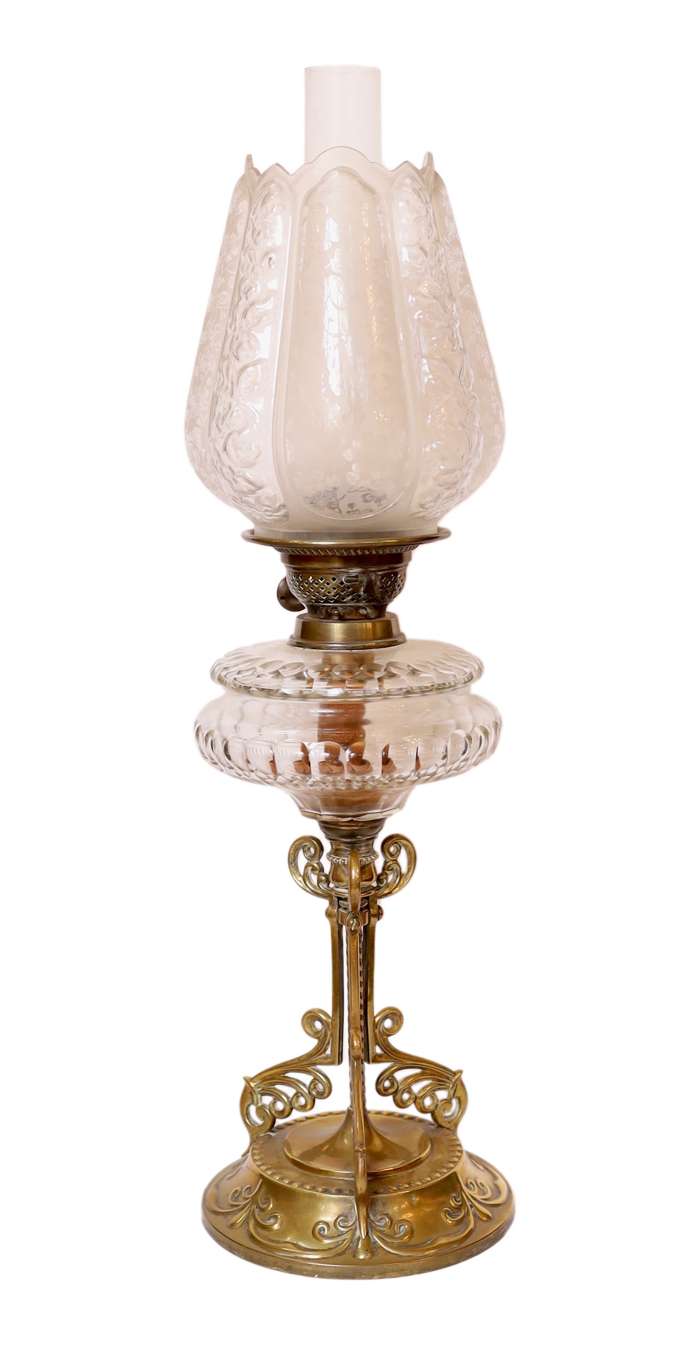 A late Victorian brass and cut glass oil lamp with duplex mechanism and frosted glass shade, height overall 65cm                                                                                                            