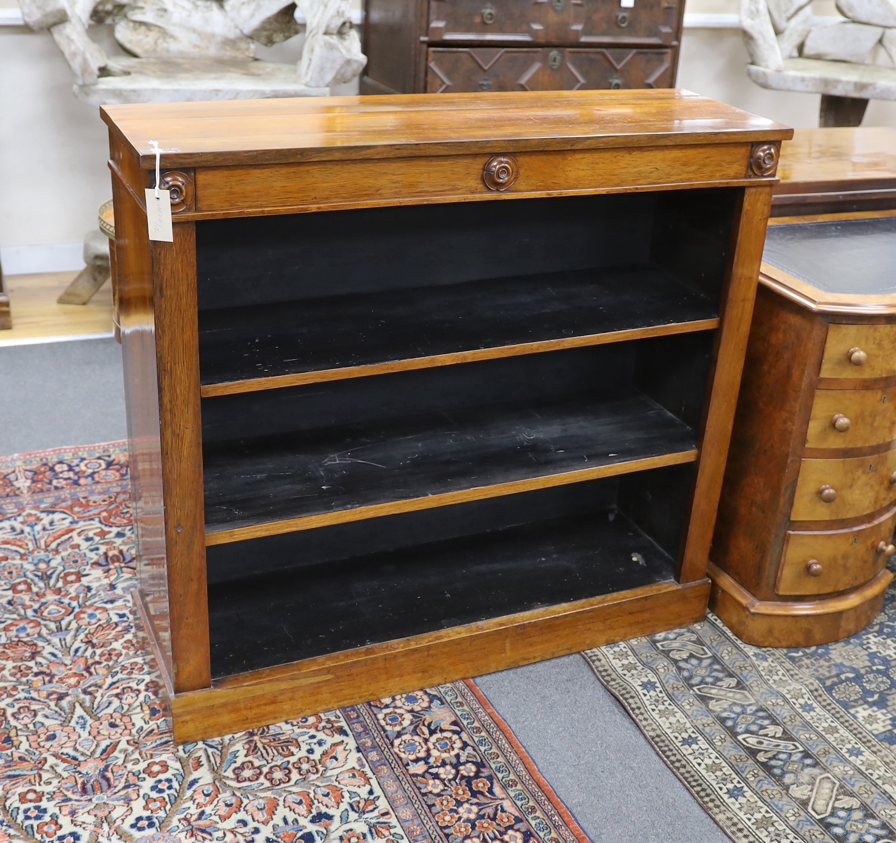 A Victorian rosewood open bookcase, width 107cm, depth 33cm, height 99cm                                                                                                                                                    