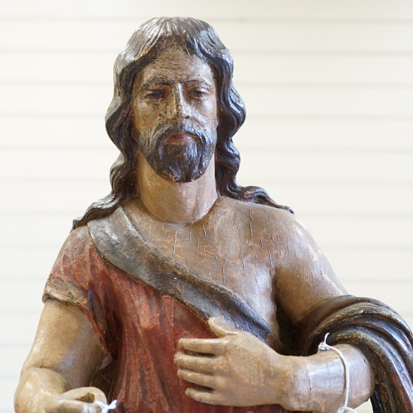 An antique carved and painted wood figure of Christ with a sheep, 69cm high                                                                                                                                                 
