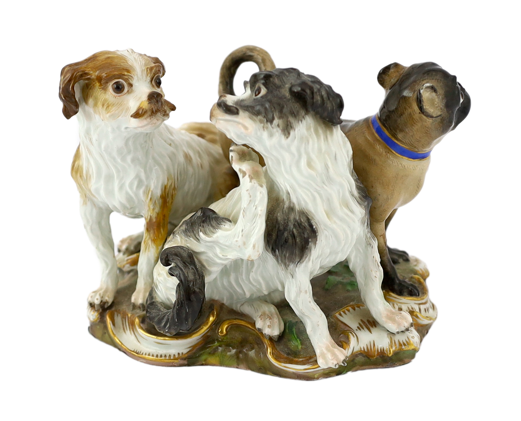 A Meissen group of two terriers and a pug-dog, modelled by Kandler, 19th century                                                                                                                                            