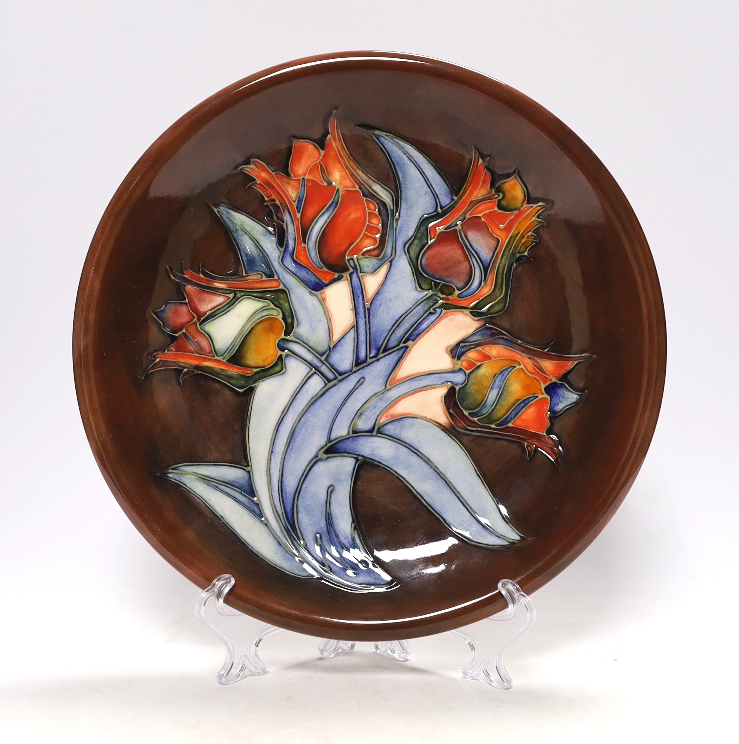 A Moorcroft 'Red Tulip' dish designed by Sally Tuffin, 26cm in diameter                                                                                                                                                     
