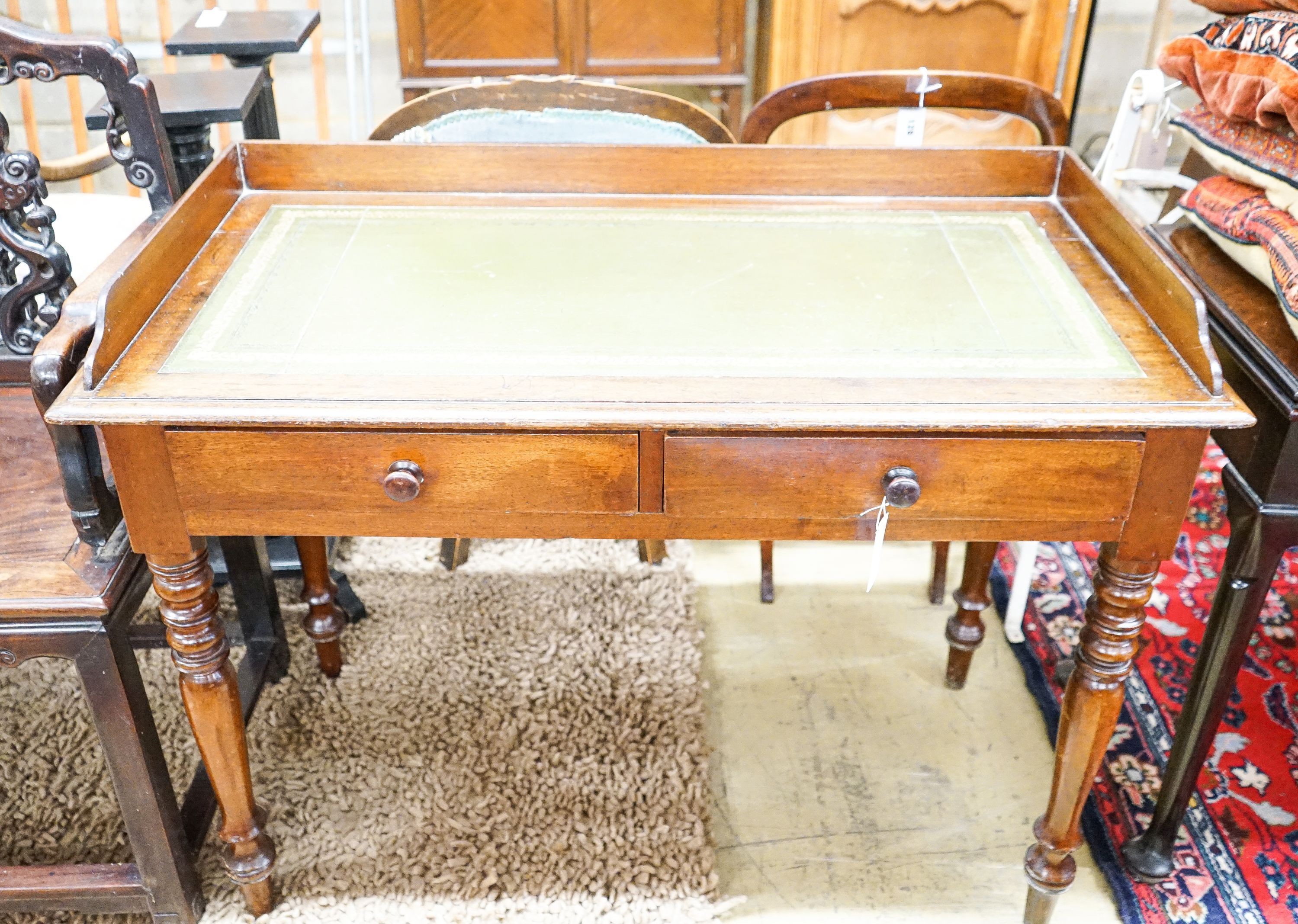 A Victorian mahogany two drawer writing table, length 106cm, depth 53cm, height 82cm                                                                                                                                        