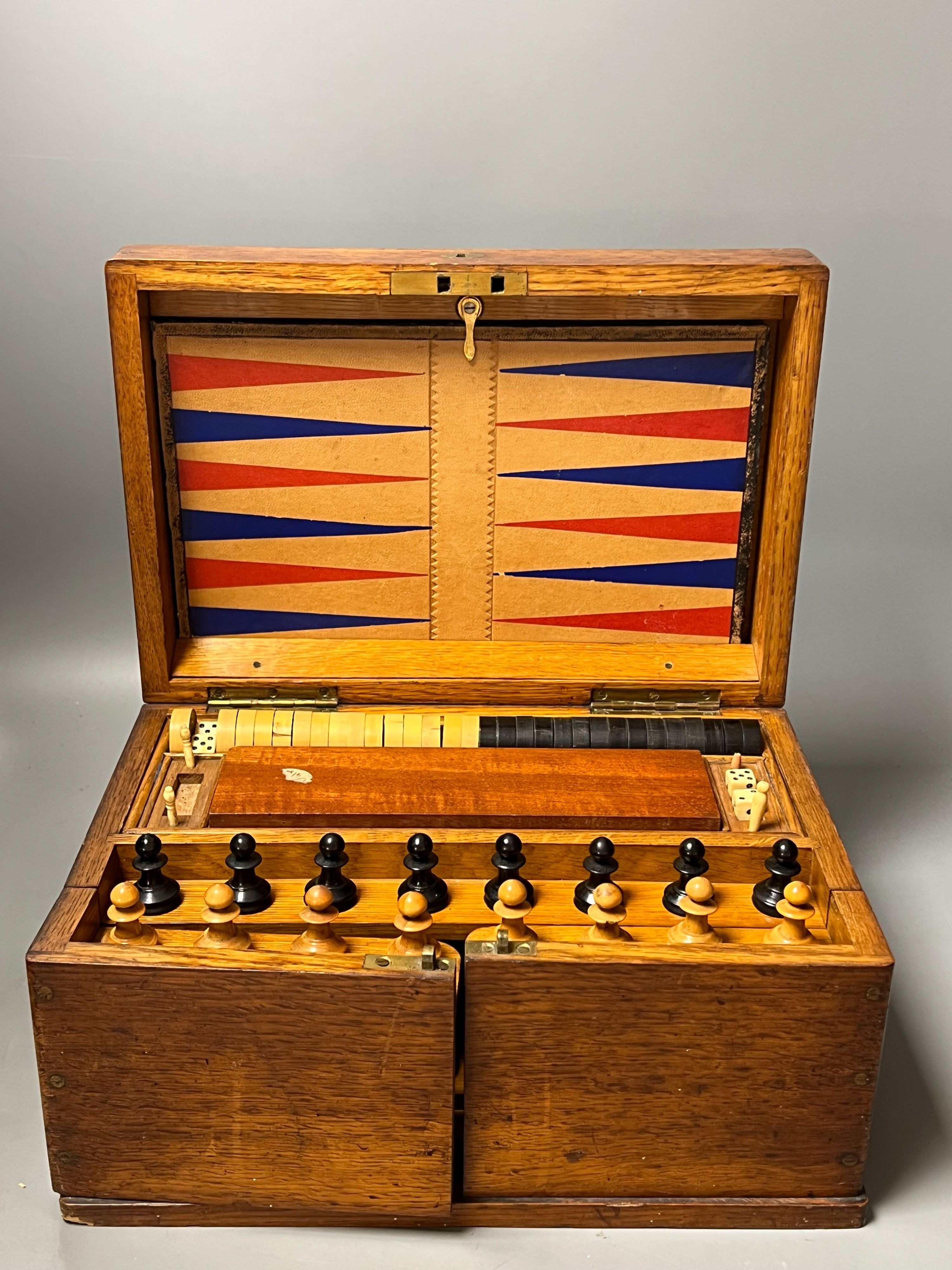 A Victorian oak games compendium, 32cm wide                                                                                                                                                                                 