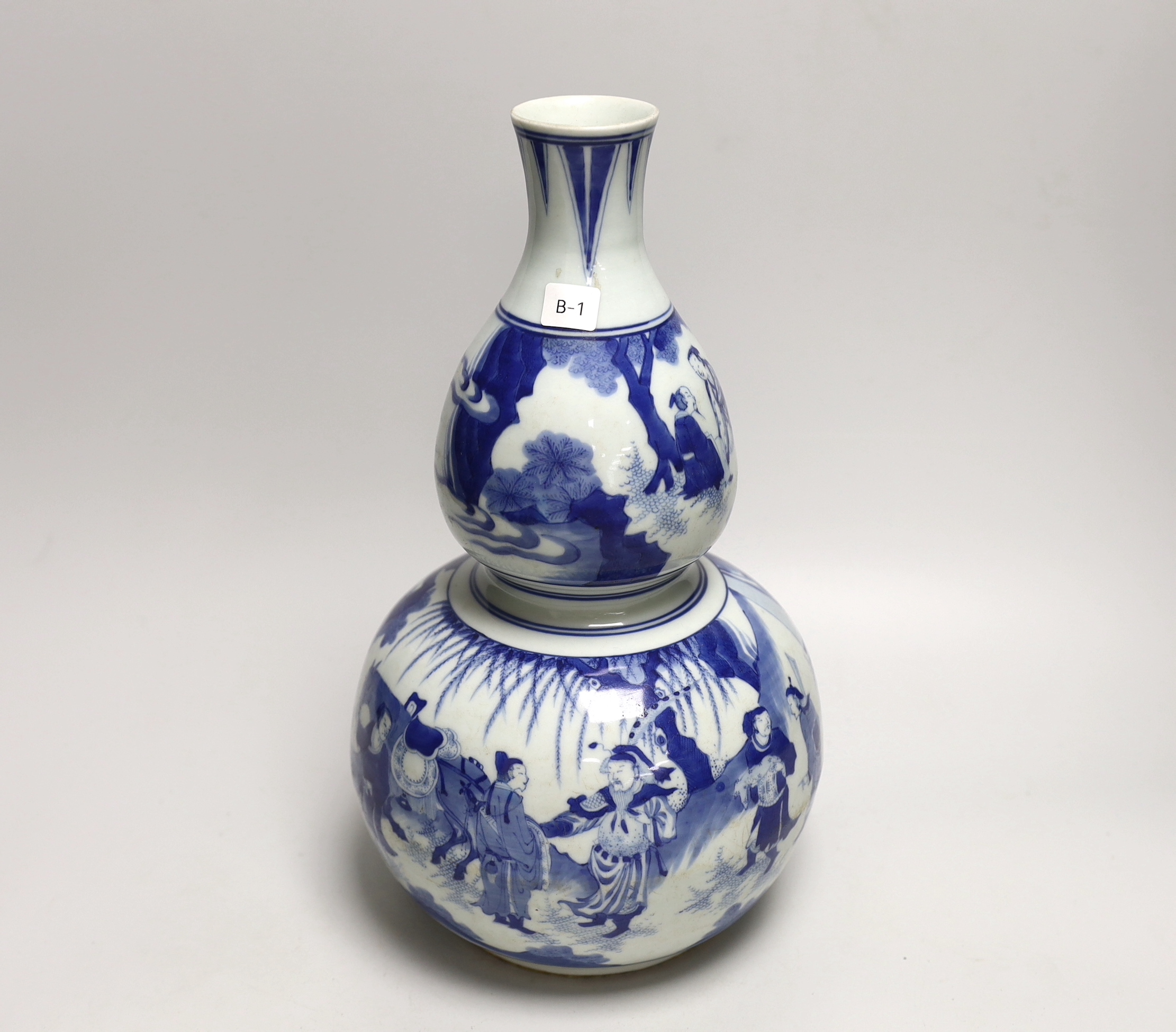 A Chinese blue and white double gourd vase, 33cm                                                                                                                                                                            