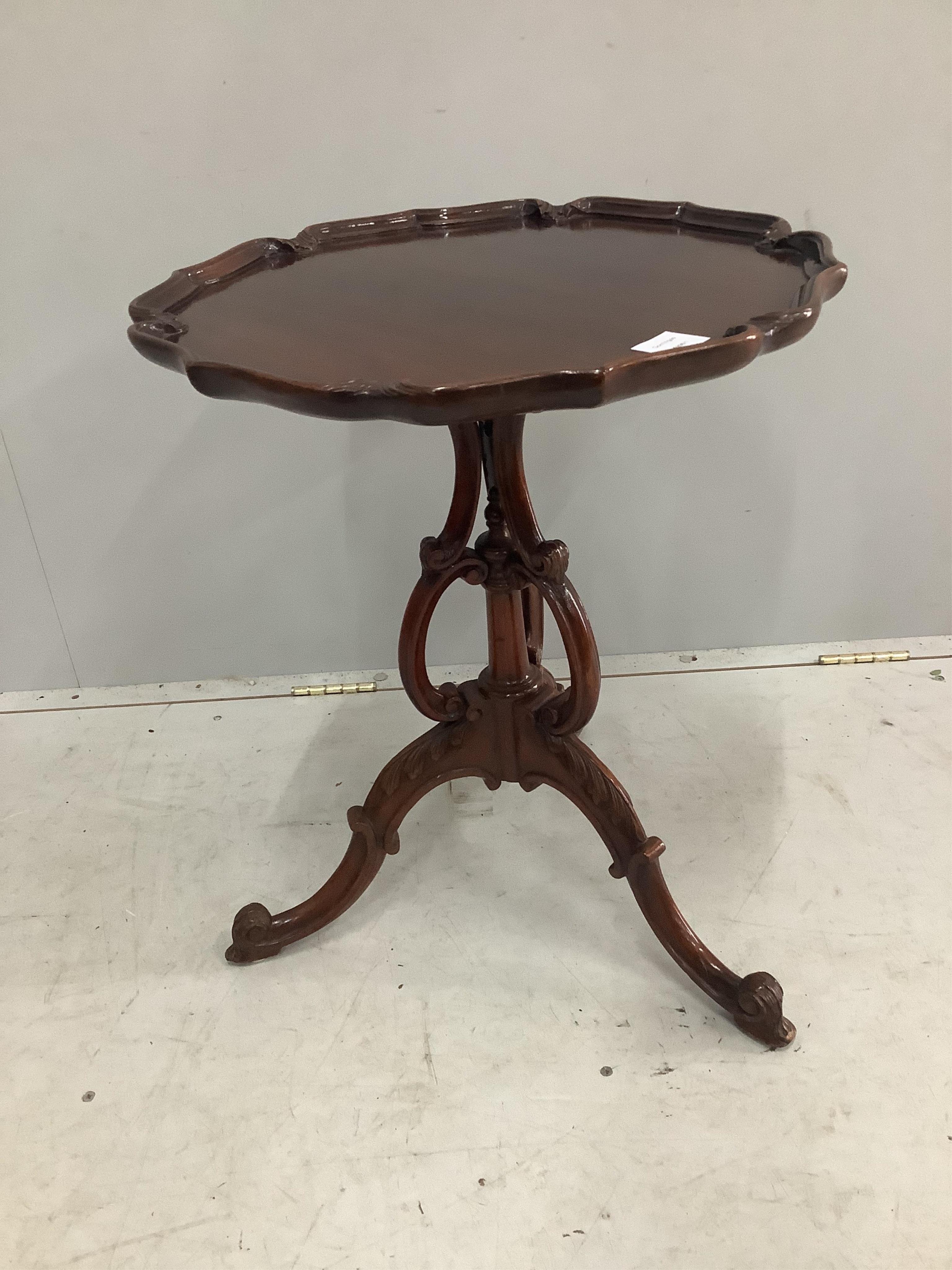 A George III style mahogany tripod wine table, by Henderson, diameter 50cm, height 60cm. Condition - good                                                                                                                   