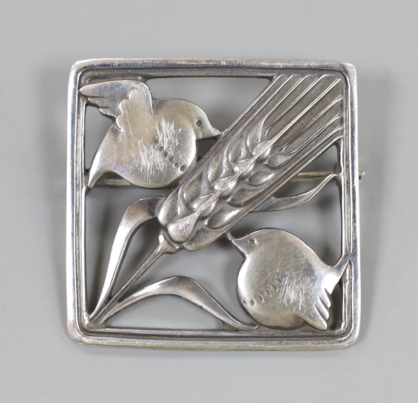 A Georg Jensen sterling square 'Robin and frond' brooch, no. 250, 36mm.                                                                                                                                                     