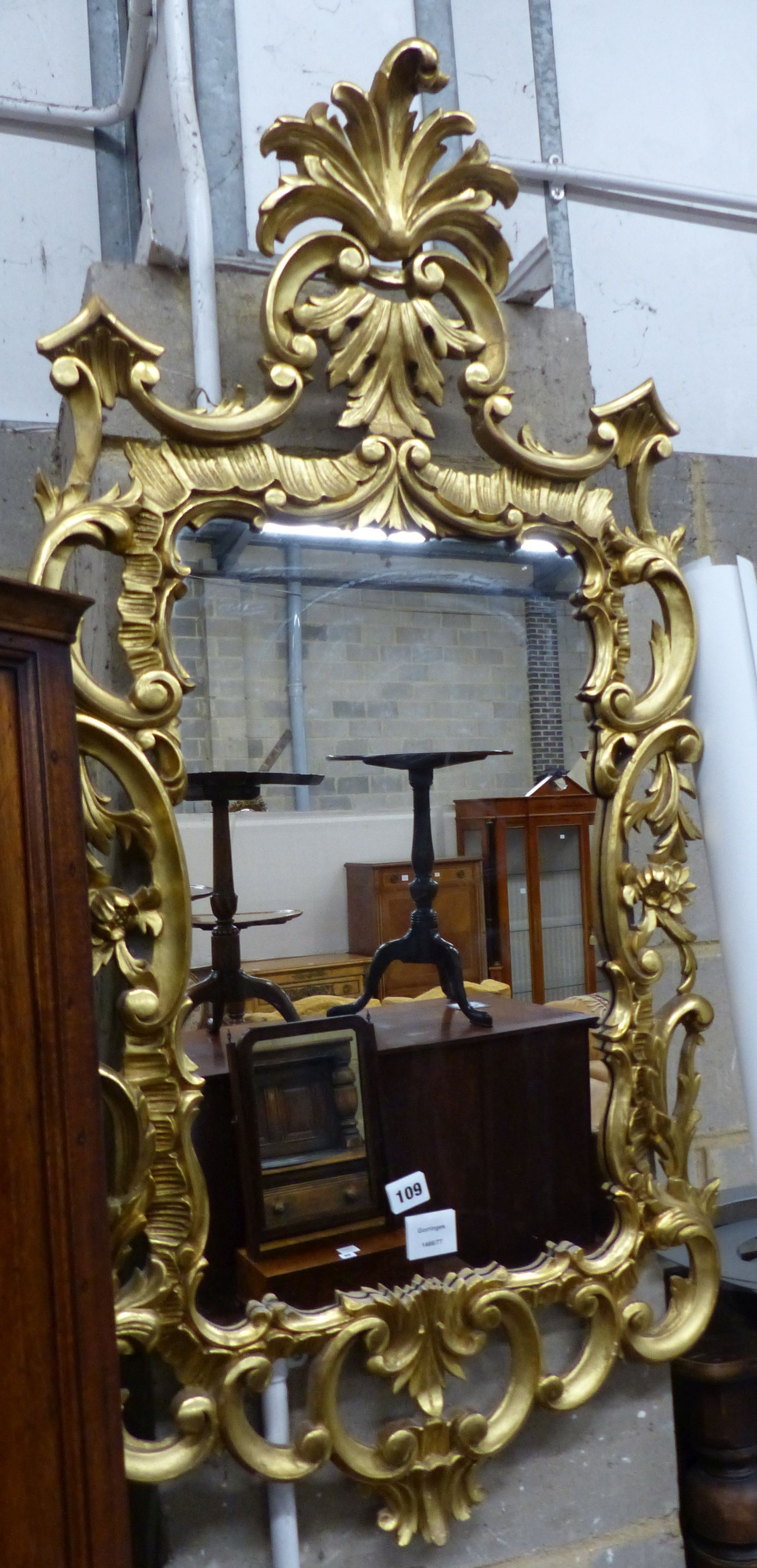 A George III style carved giltwood wall mirror, W.60cm H.114cm                                                                                                                                                              