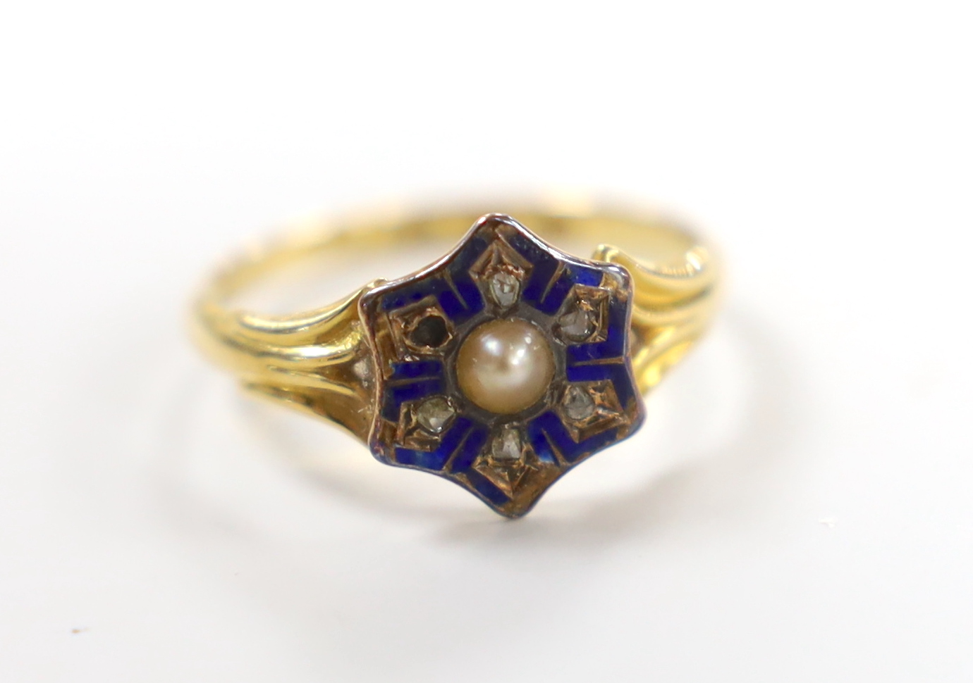 A Victorian 18ct gold, enamel, split pearl and rose cut diamond chip set cluster ring, size N/O, gross weight 2.5 grams, in case.                                                                                           