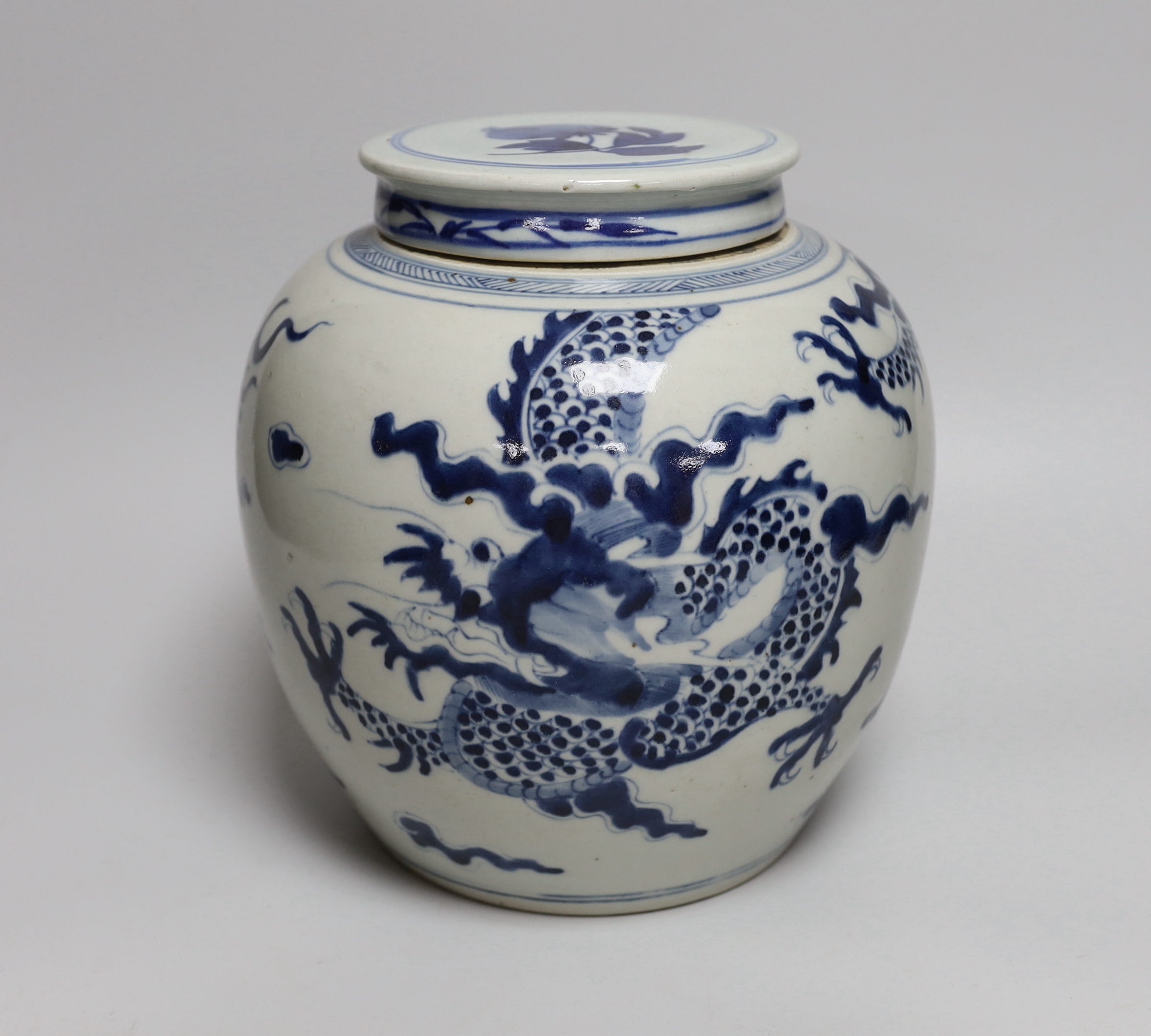 An 18th/19th century Chinese blue and white ‘dragon’ jar, with associated cover, jar 20.5cm high                                                                                                                            