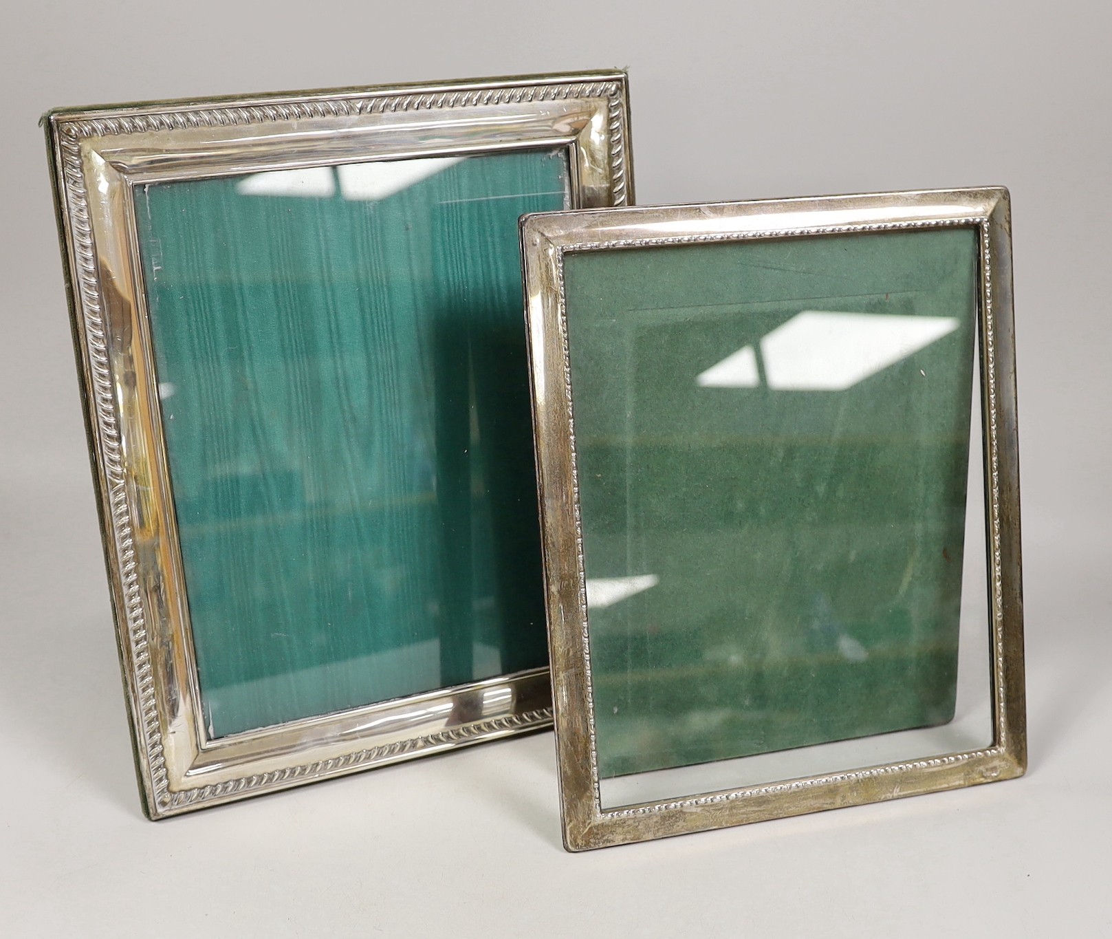 Two modern silver mounted rectangular photograph frames, largest, 32cm.                                                                                                                                                     