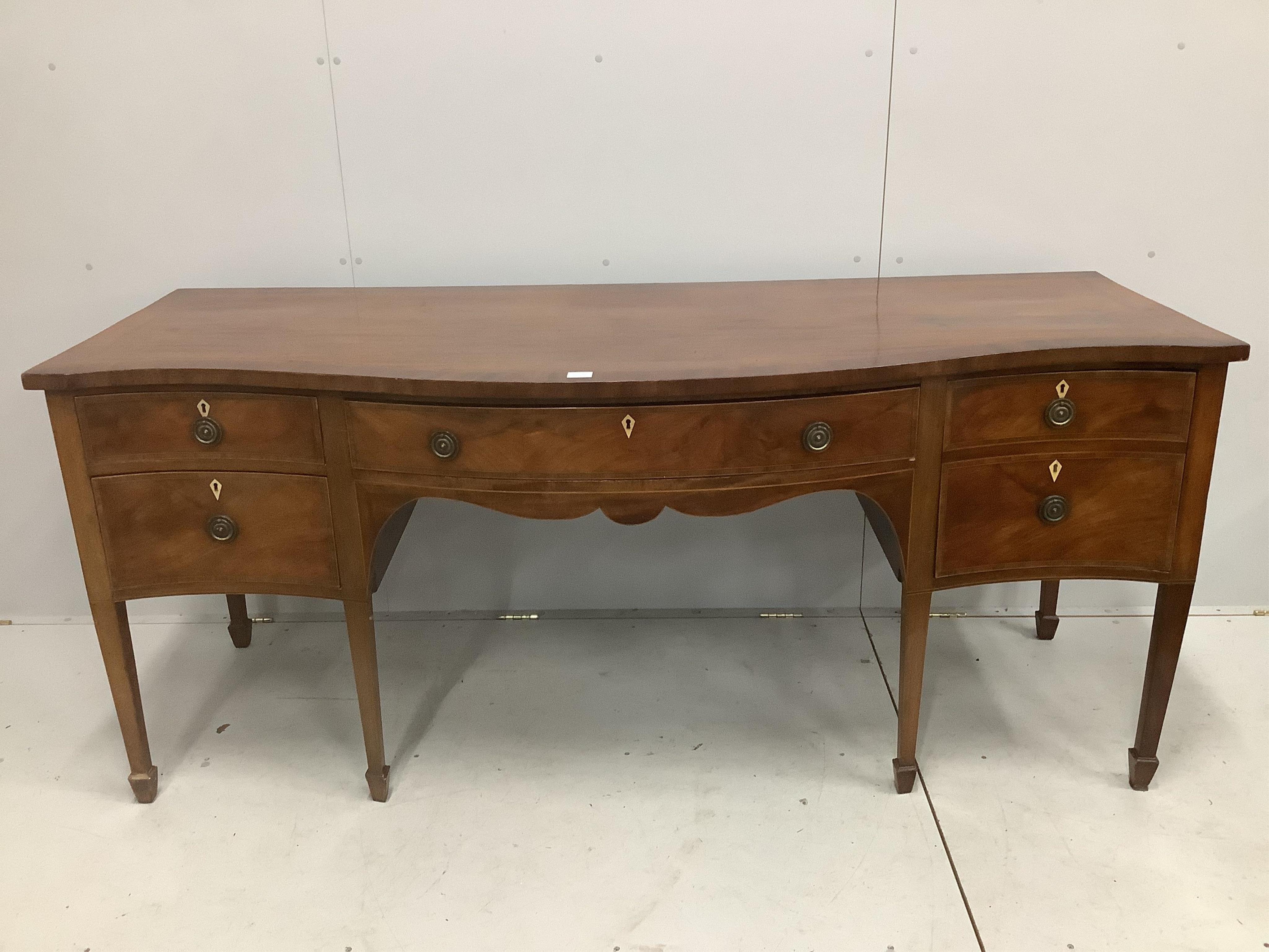 A George III serpentine mahogany sideboard, width 202cm, depth 79cm, height 87cm. Condition - fair                                                                                                                          