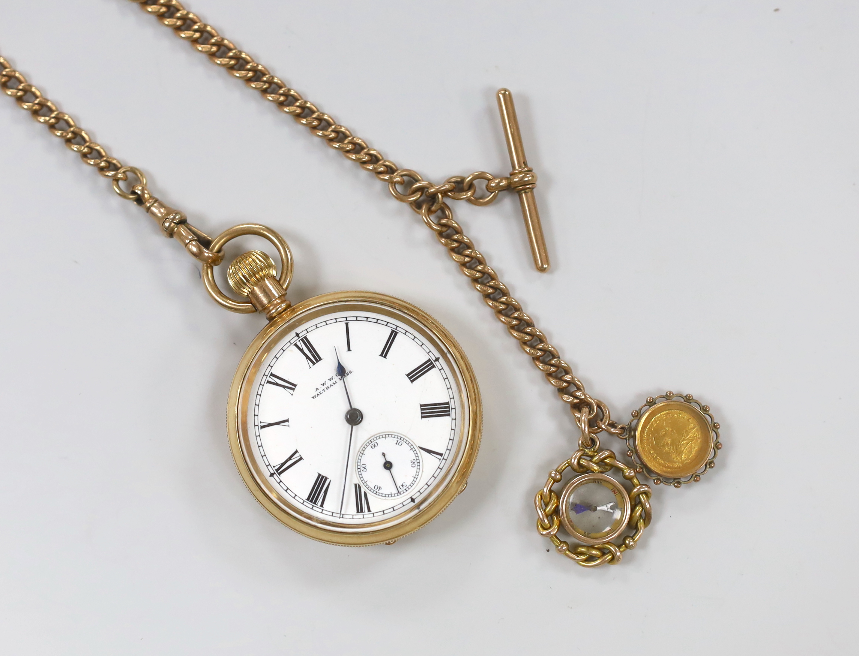 A Waltham gold plated open face pocket watch, with Roman dial and subsidiary seconds, on a 9ct gold albert hung with two fobs including compass, albert gross 54.5 grams.                                                   