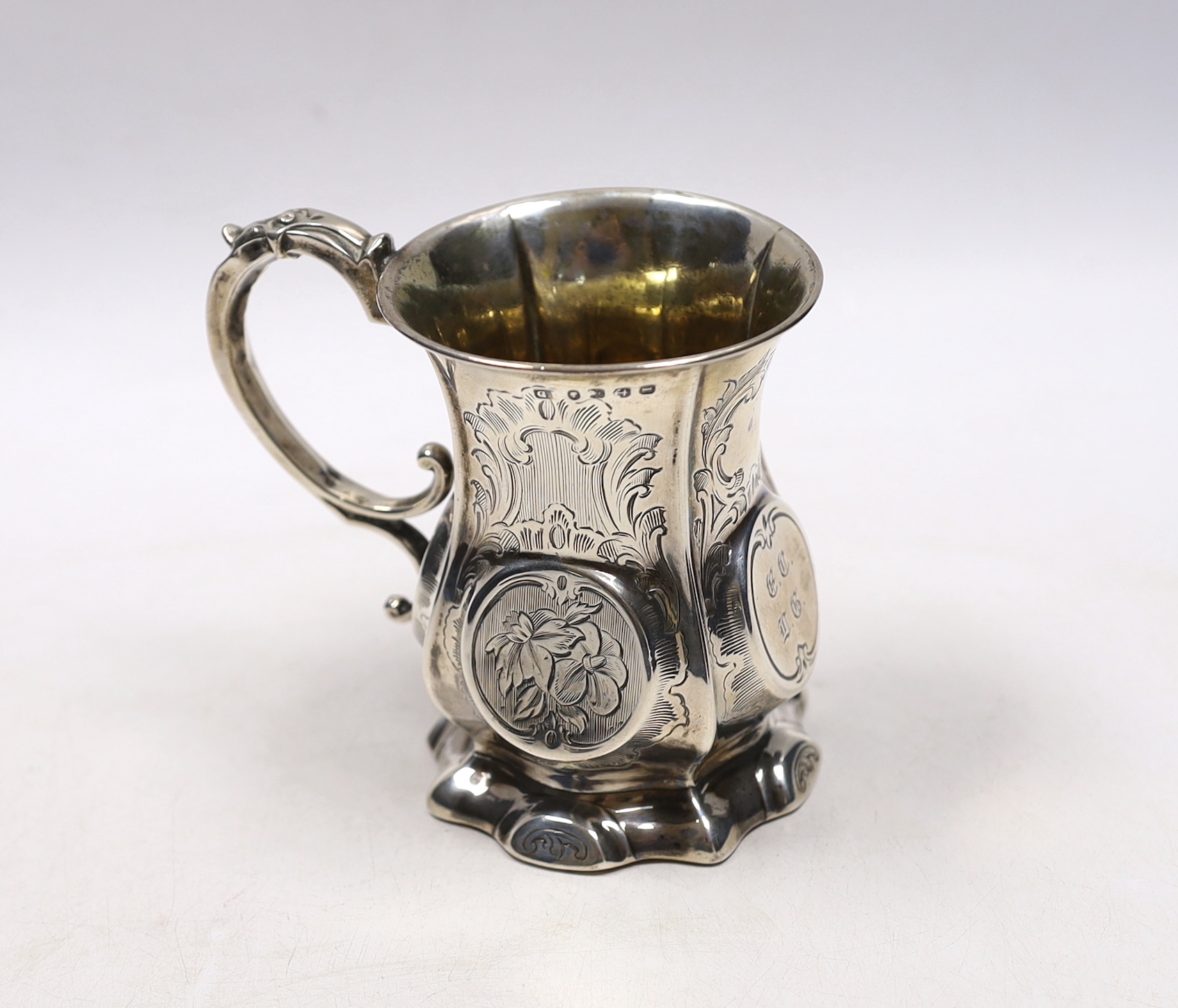 A Victorian engraved silver christening mug, George Unite?, Birmingham, 1857, 10.2cm.                                                                                                                                       