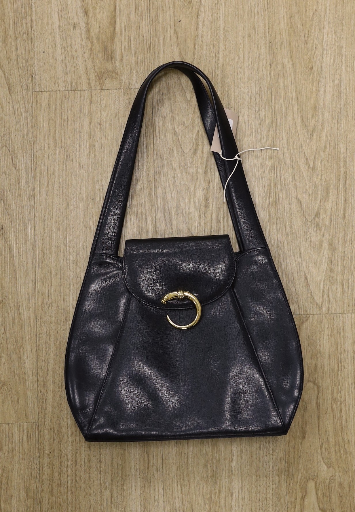 A Cartier “Panther” bag - black, 54cms high from top of strap to base of bag                                                                                                                                                