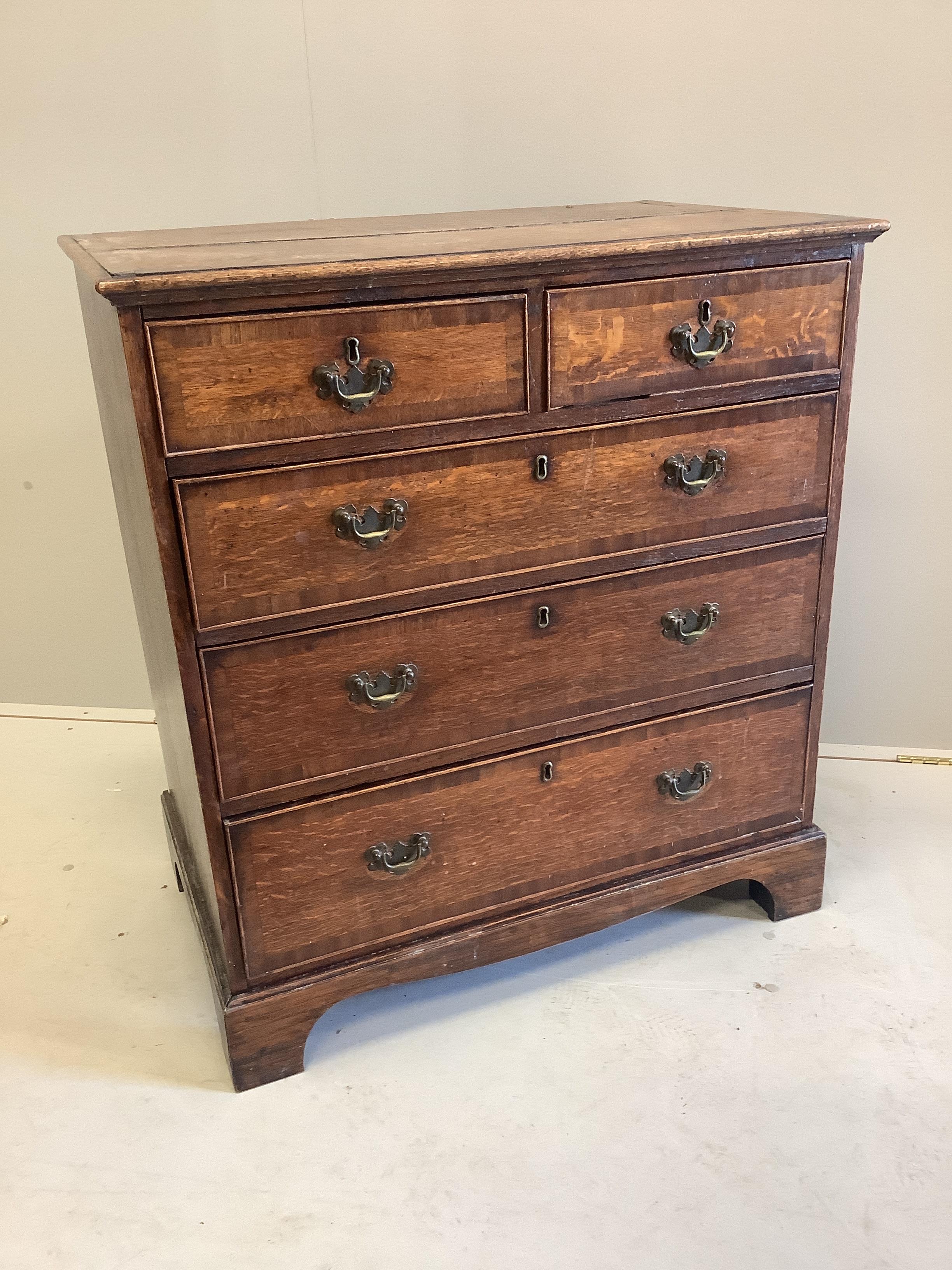A George III mahogany banded oak chest of five drawers, width 83cm, depth 51cm, height 92cm                                                                                                                                 