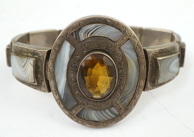 A late Victorian white metal, citrine and Scottish hardstone set bracelet. Condition - poor to fair                                                                                                                         