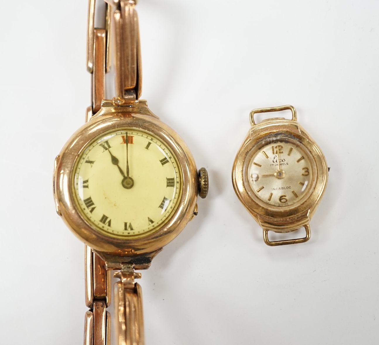 A lady's early 20th century 9ct gold manual wind wrist watch, on a 9ct expanding bracelet, gross weight 19.4 grams, together with a lady's 9ct gold Elco watch. Condition - poor                                            