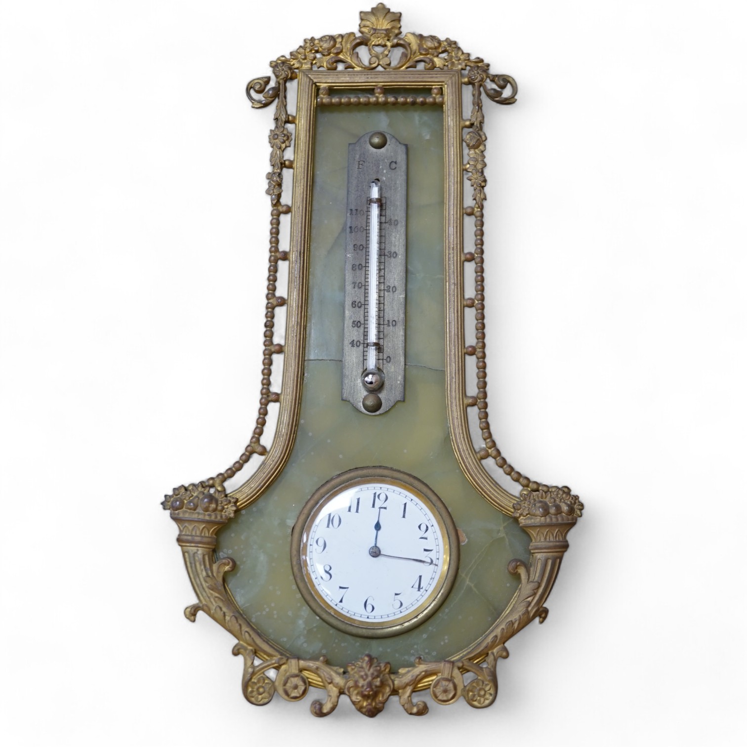 An onyx and gilt metal easel timepiece and thermometer, 20cm high. Condition - fair                                                                                                                                         