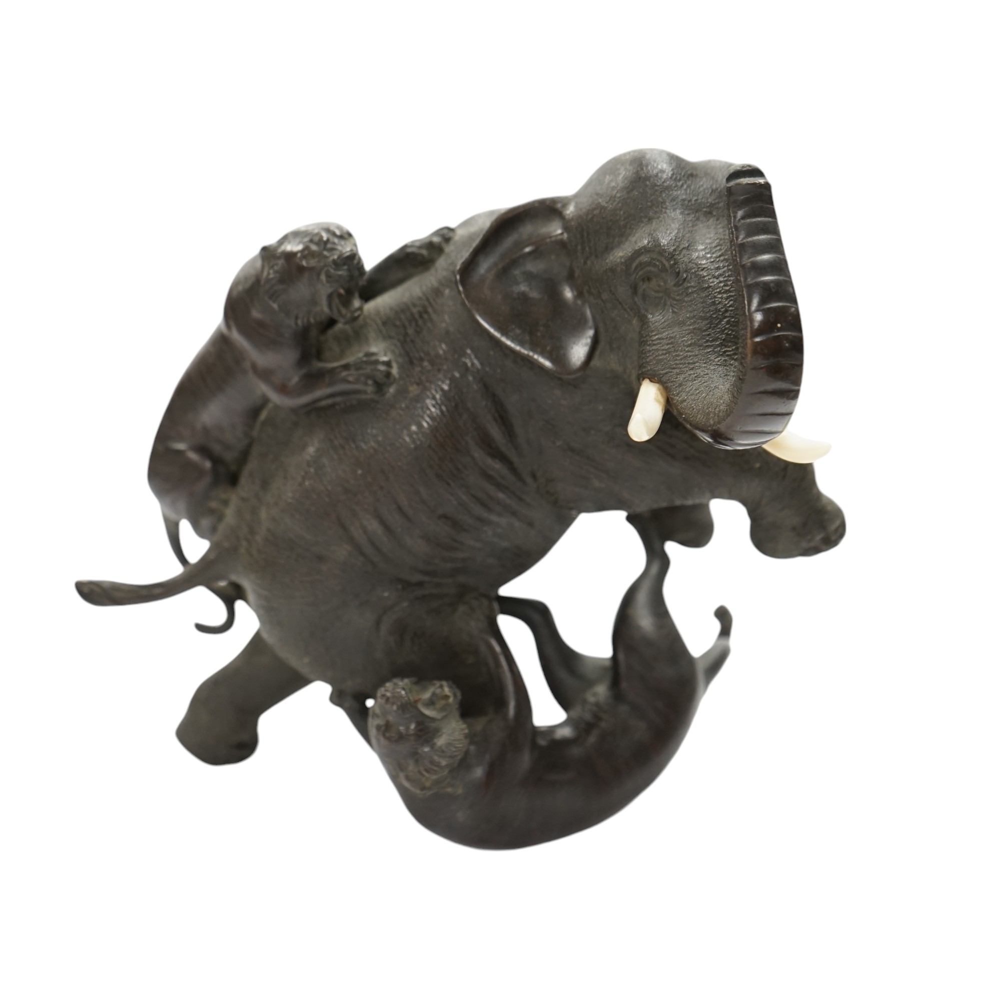 After Genryusai Seiya (1868-1912), a 19th century Japanese Meiji period cast bronze group of an elephant being attacked by tigers, seal mark, 14cm high. CITES Submission reference P5SHZWF1. Condition - good              