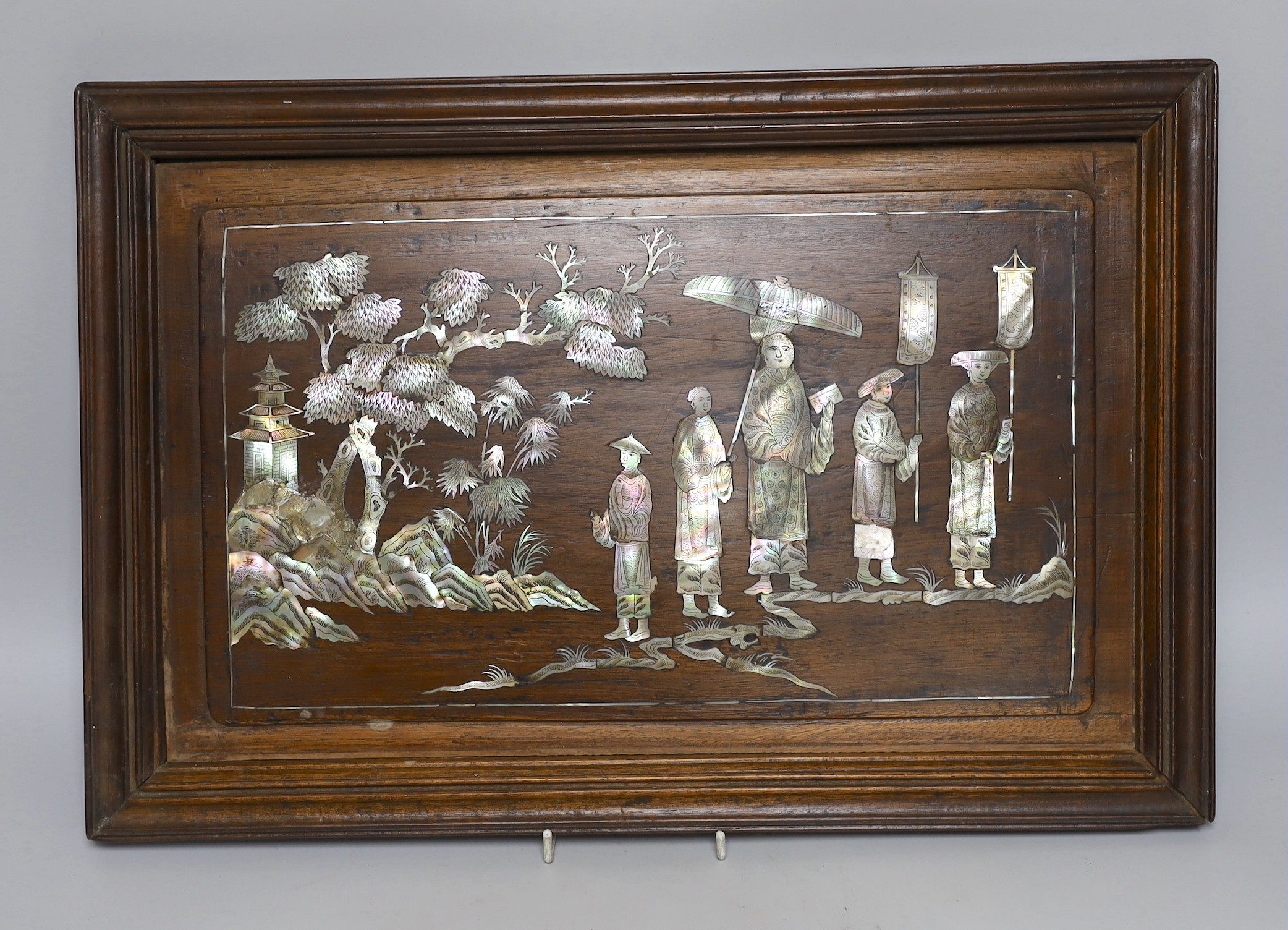 A Chinese hardwood mother-of-pearl inlaid wall hanging, 48cms wide, 33cms high                                                                                                                                              