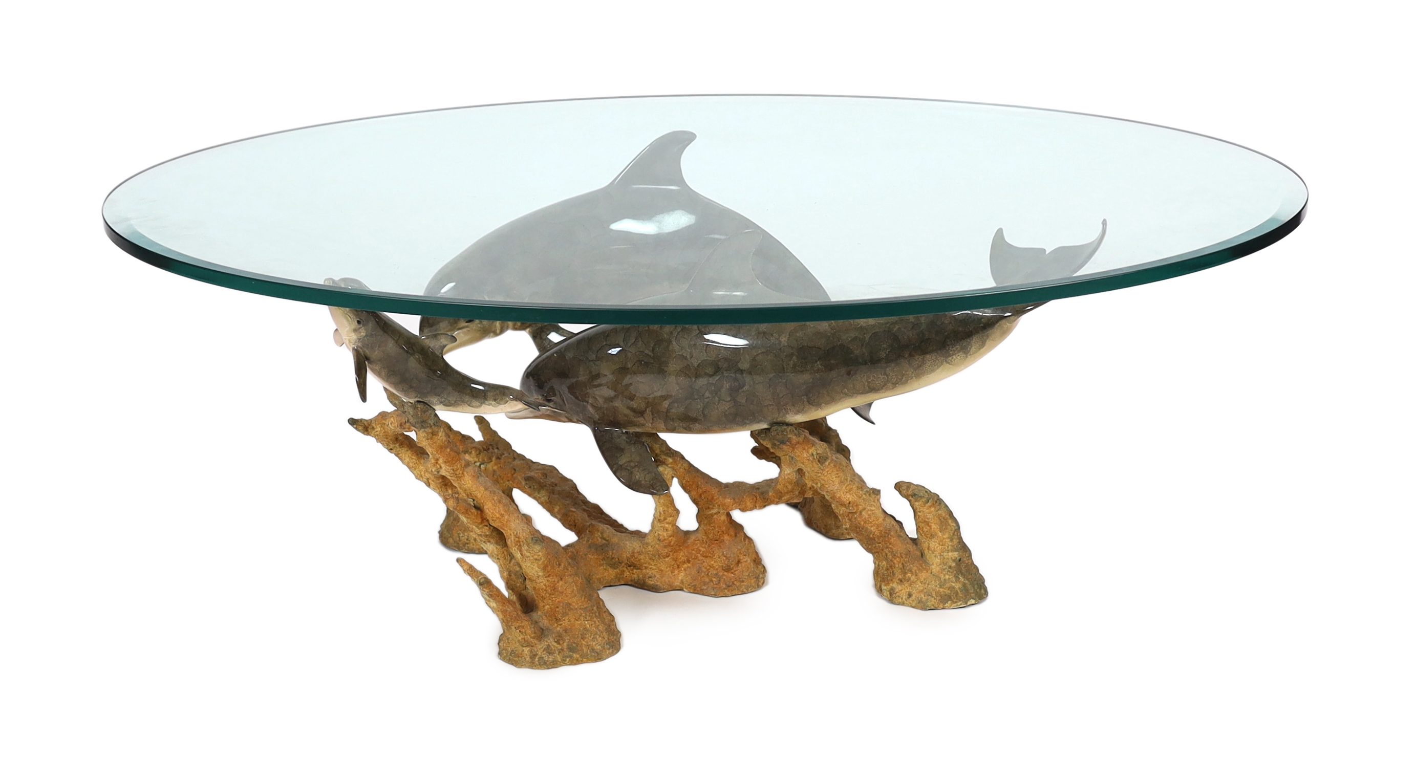 Robert Wyland (American, b.1956), a patinated bronze group 'Dolphin Reef', 81cm long, 53cm deep, 45.5cm high, comes with a plate glass oval top, 130 x 81cm                                                                 