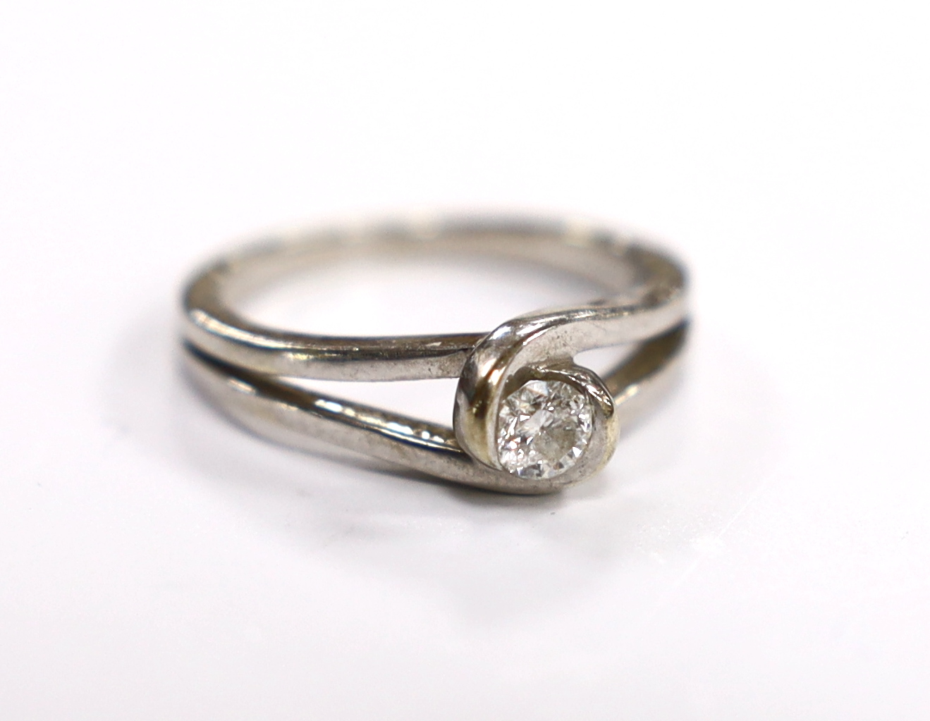 A 9ct white gold and solitaire stone diamond set ring, the stone weighing approx. 0.15cts, size L/M, gross weight 3.4 grams.                                                                                                