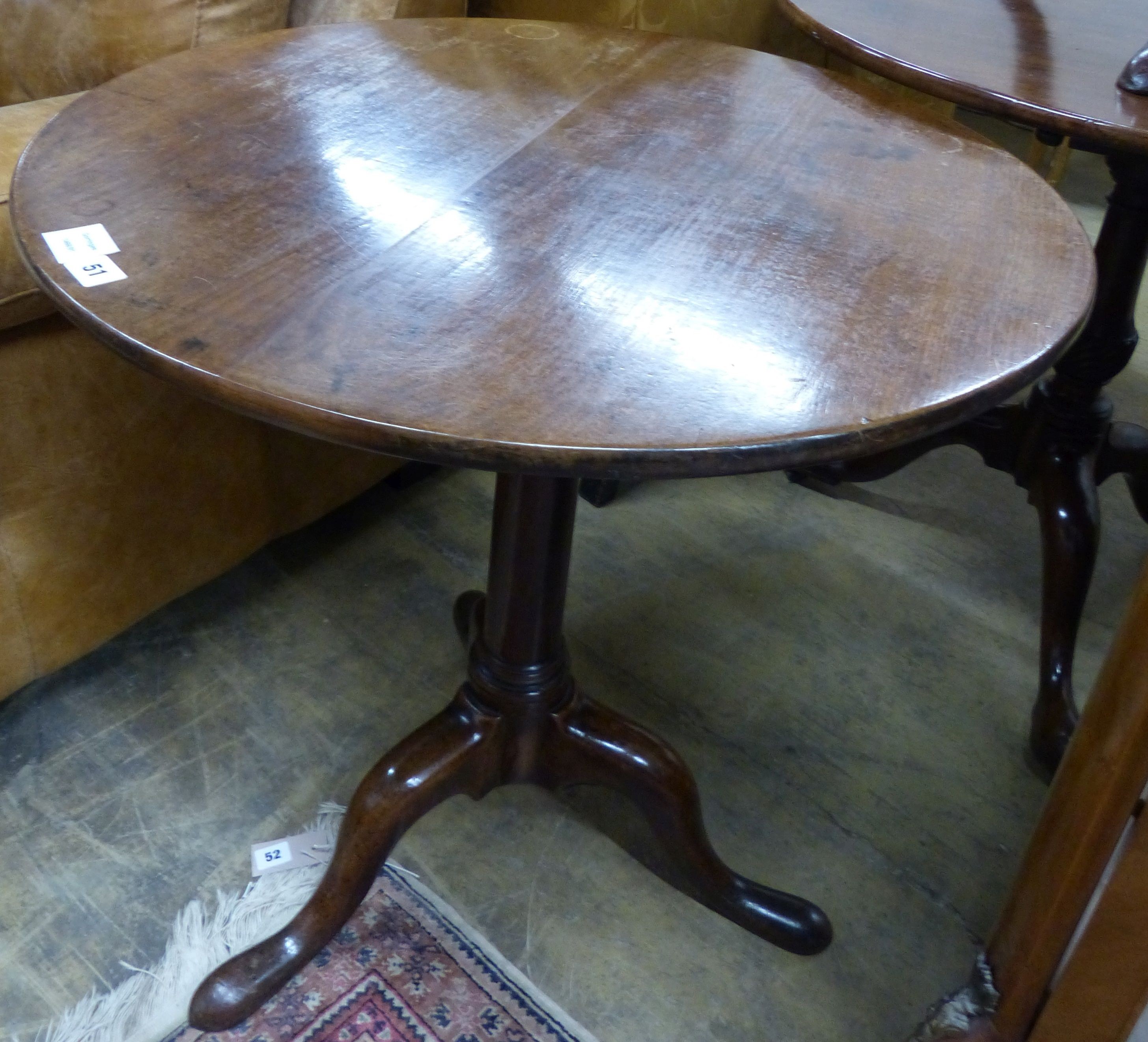 A George III circular mahogany tilt top tripod tea table, Diam.71cm H.70cm                                                                                                                                                  