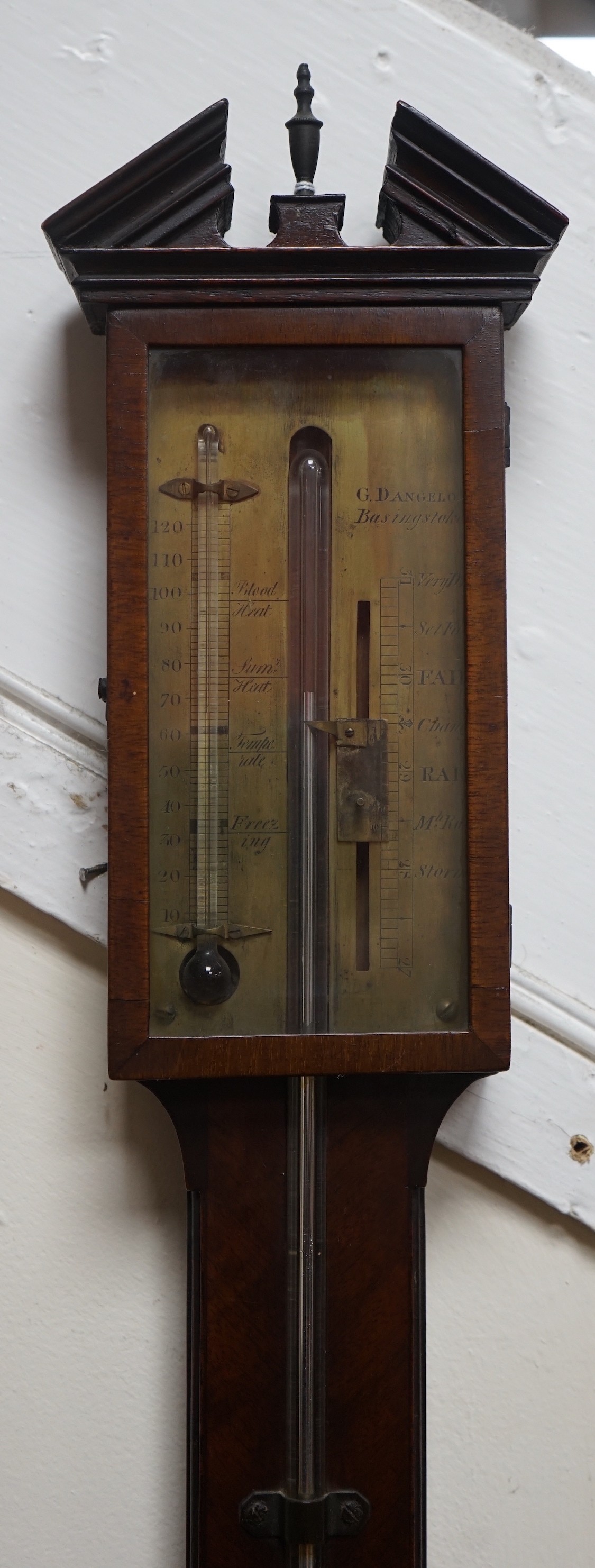 A George III mahogany stick barometer, the engraved brass dial marked Dangelo, Basingstoke, height 98cm                                                                                                                     