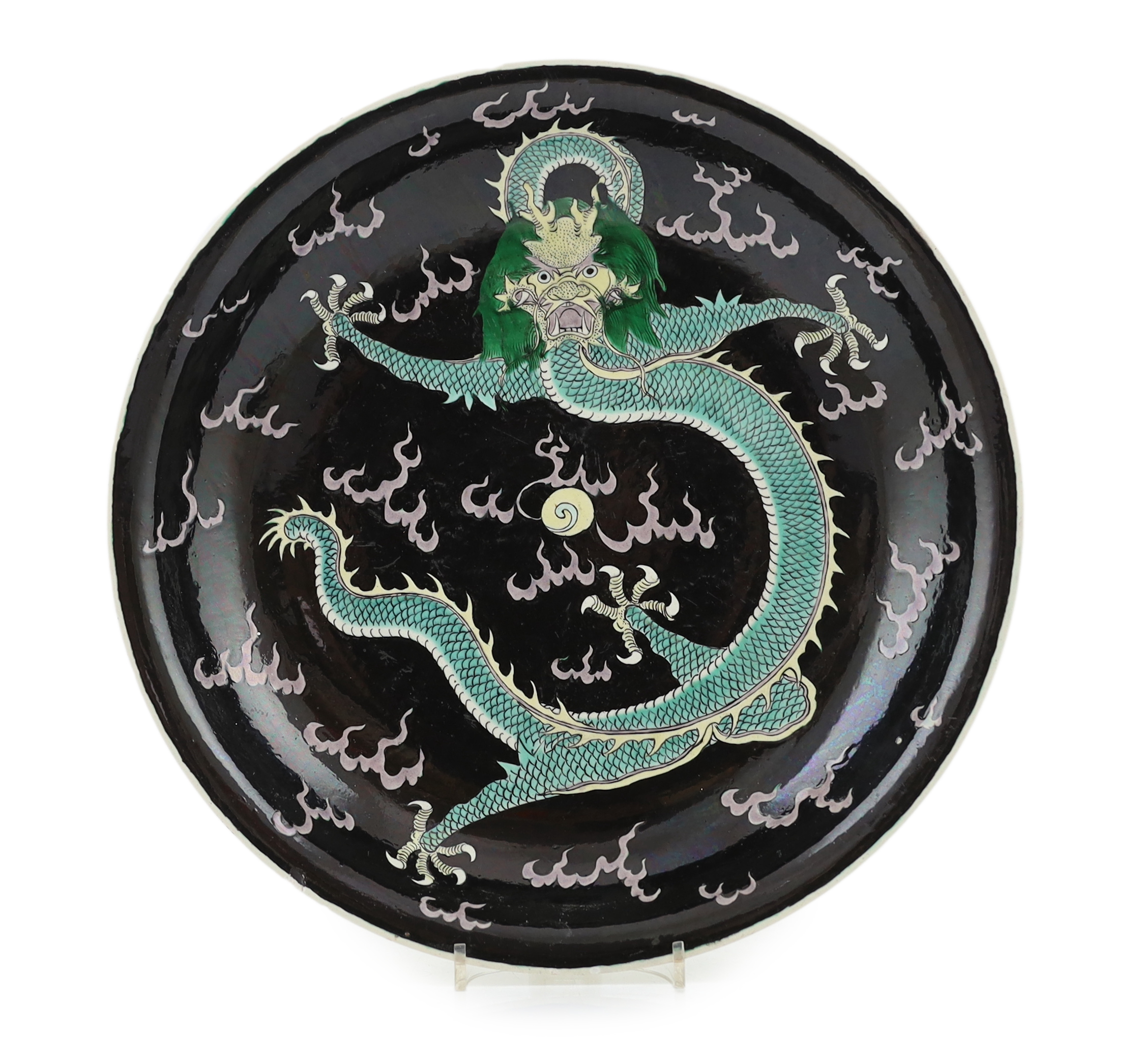 A Chinese enamelled porcelain 'dragon' dish, Kangxi mark but 19th century, small splinter rim chip, rim ground off                                                                                                          