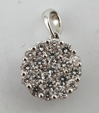 A modern Iliana 18ct white gold and pave set diamond cluster circular pendant, 10mm, gross weight 1.8 grams. Condition - good                                                                                               