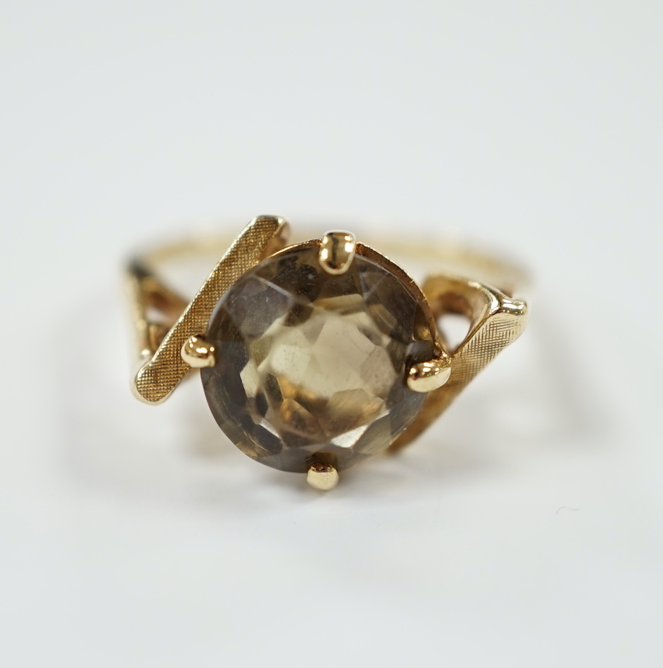 A 14k yellow metal and single stone citrine set dress ring, size N/O, gross weight 3.9 grams.                                                                                                                               