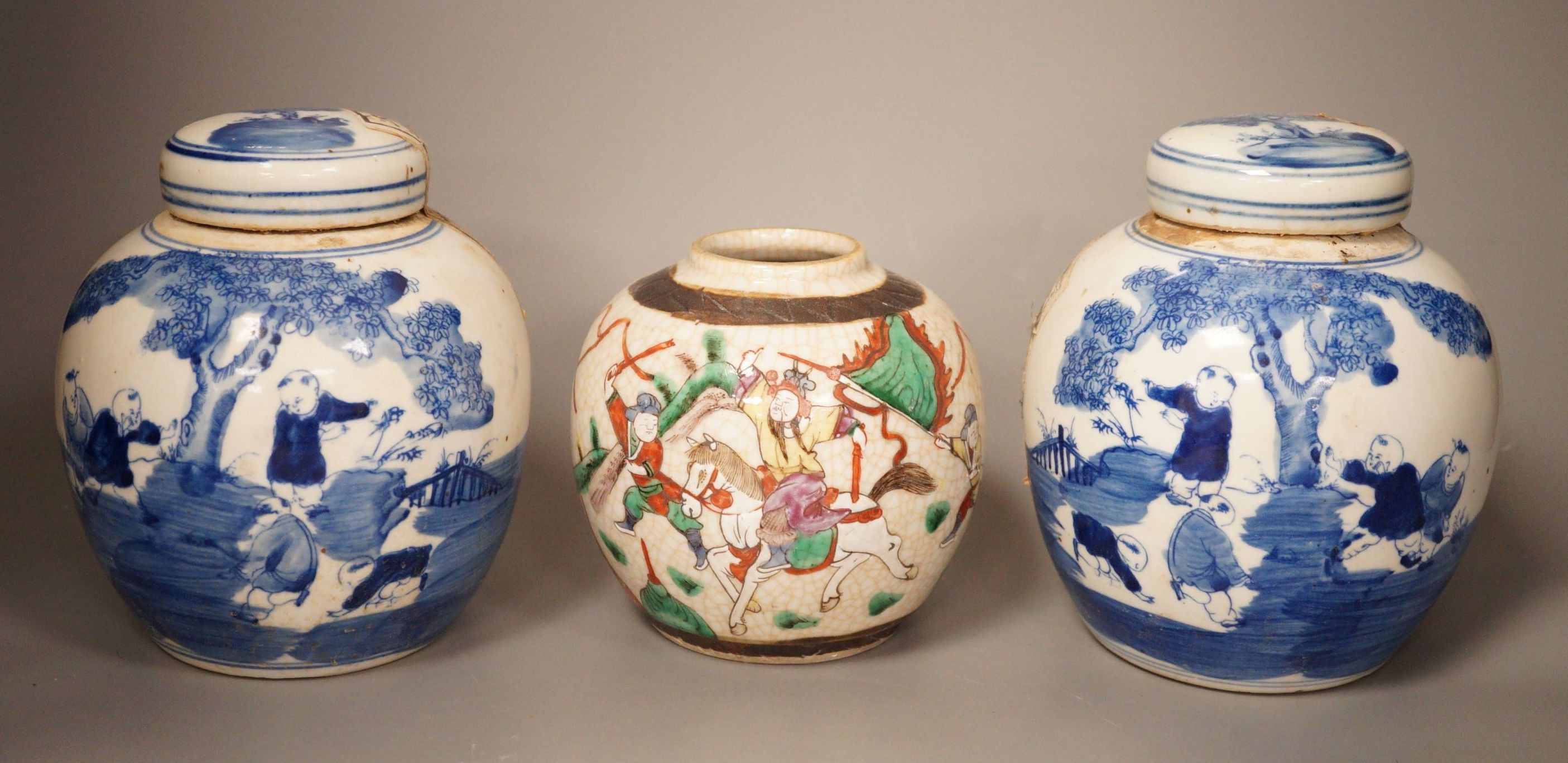 A Chinese crackleglaze famille rose jar and two blue and white jars, 16cm                                                                                                                                                   