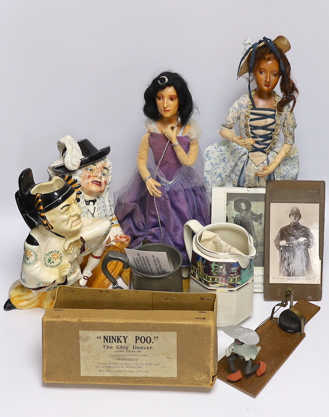 Gilbert & Sullivan and D’Oyly interest; a collection of ceramics, puppets, photographs, etc. including a Nanki Poo Toby jug, a D’Oyly Carte engraved pewter mug, a ‘Ninky Poo’ gramophone operated Clog Dancer, etc.        