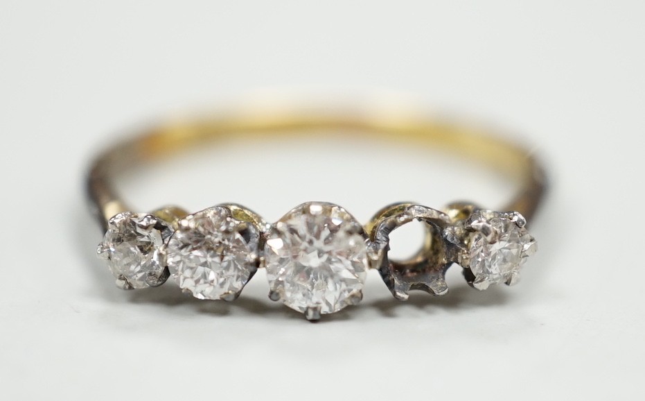 An 18ct and graduated five stone diamond set half hoop ring, size P, gross weight 1.9 grams, one stone loose but present.                                                                                                   