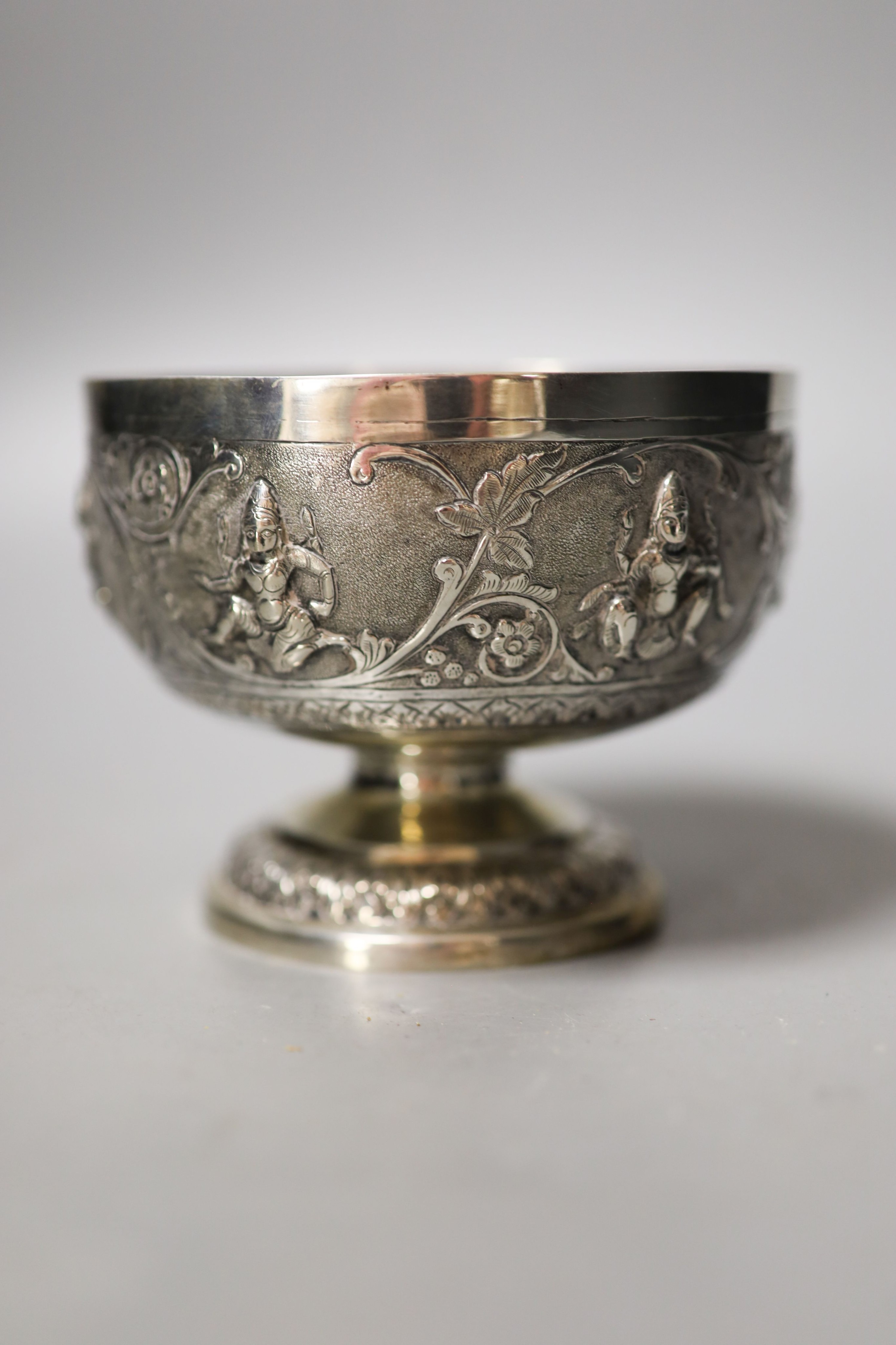 An Indian embossed white metal pedestal bowl, diameter 10.7cm.                                                                                                                                                              