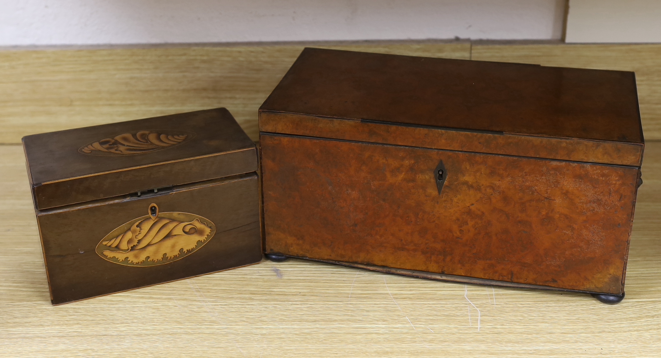 A George IV burr walnut tea caddy, 34cm and a George III harewood and marquetry tea caddy                                                                                                                                   