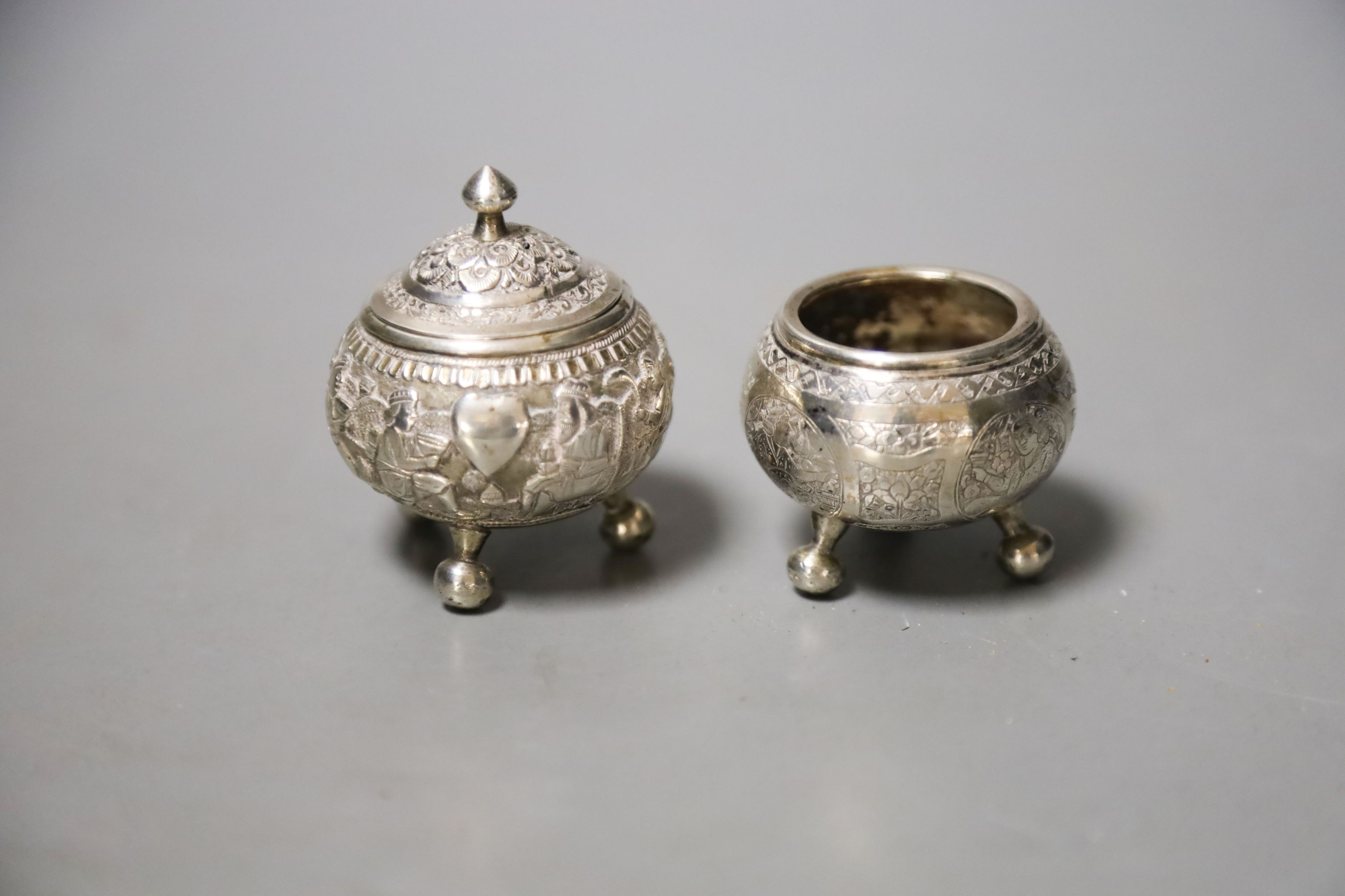 Two small Indian white metal condiments, tallest 57mm.                                                                                                                                                                      