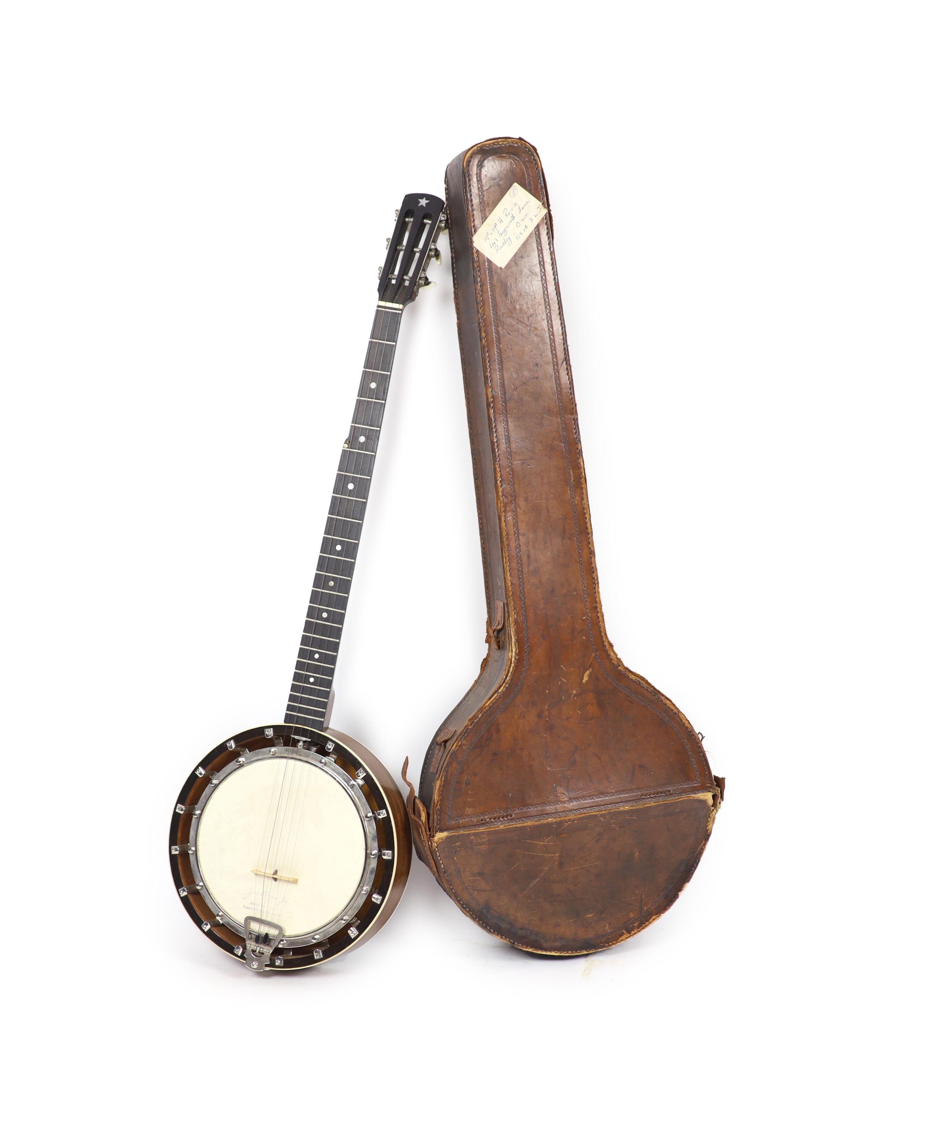 A Clifford Essex ebony mounted banjo, length 94cm, with distressed leather case                                                                                                                                             