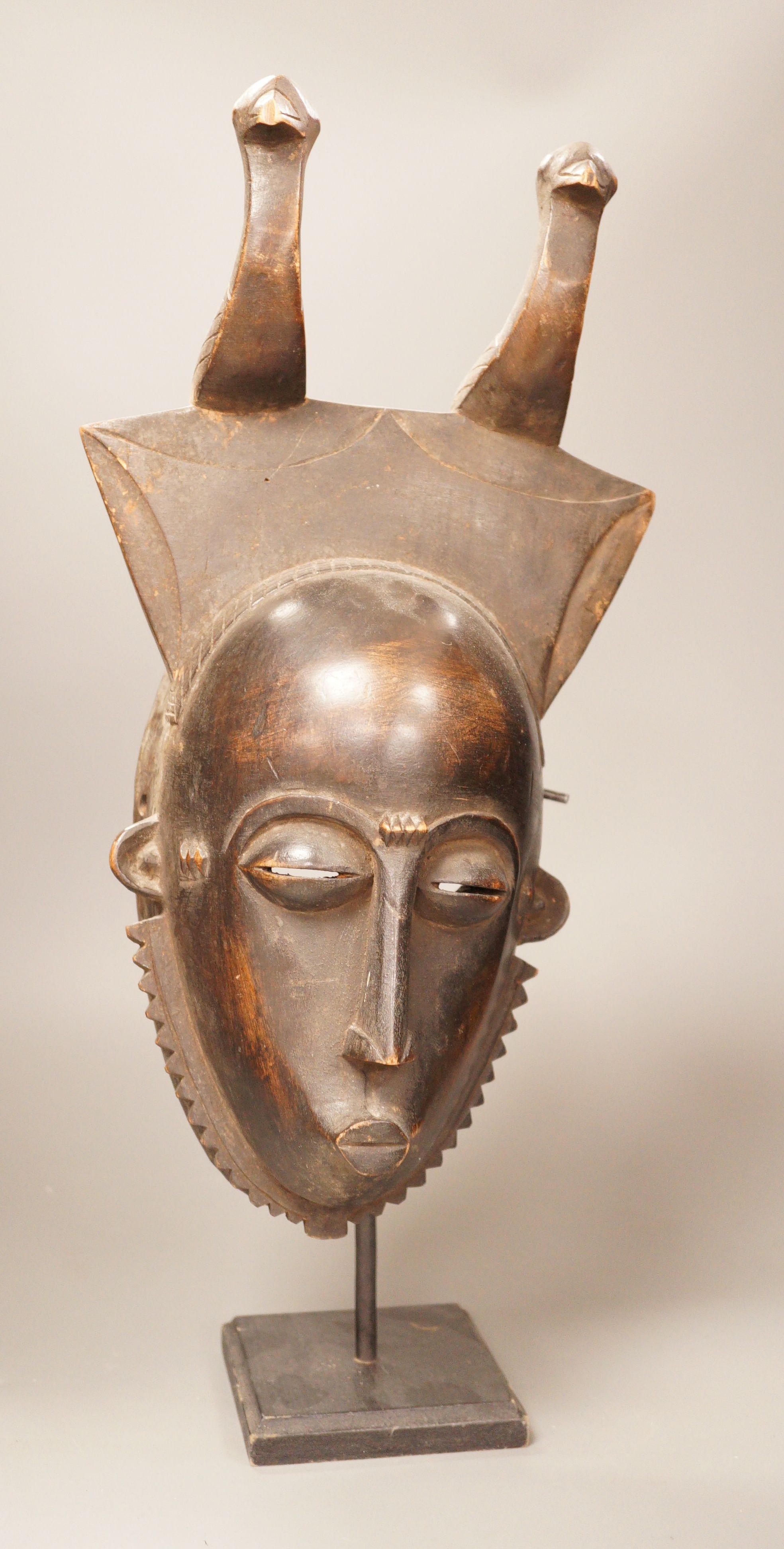 A West African tribal mask, possibly Baule, on stand, 47cm total                                                                                                                                                            