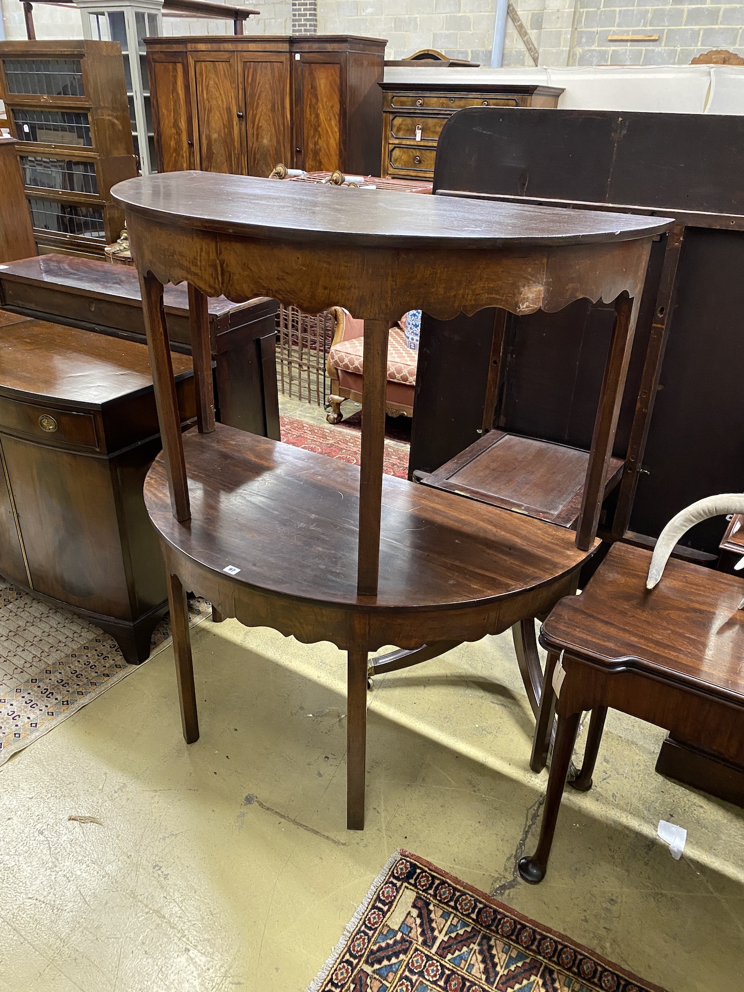 A pair of George III mahogany D end table sections, width 122cm, depth 61cm, height 71cm                                                                                                                                    