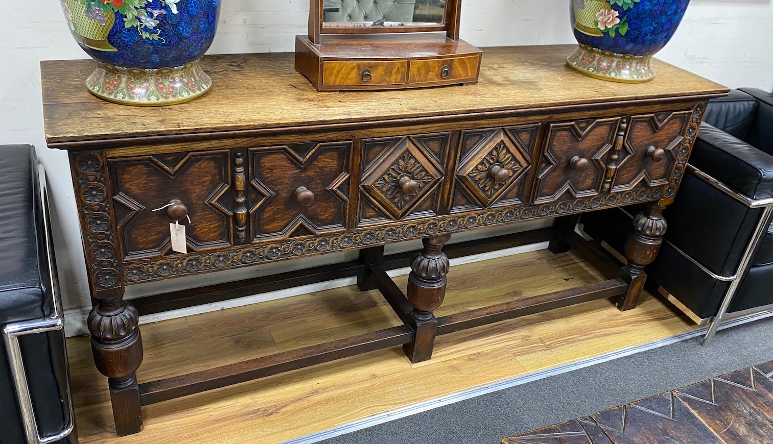 An early 20th century Jacobean revival oak low dresser, length 183cm, depth 48cm, height 83cm                                                                                                                               
