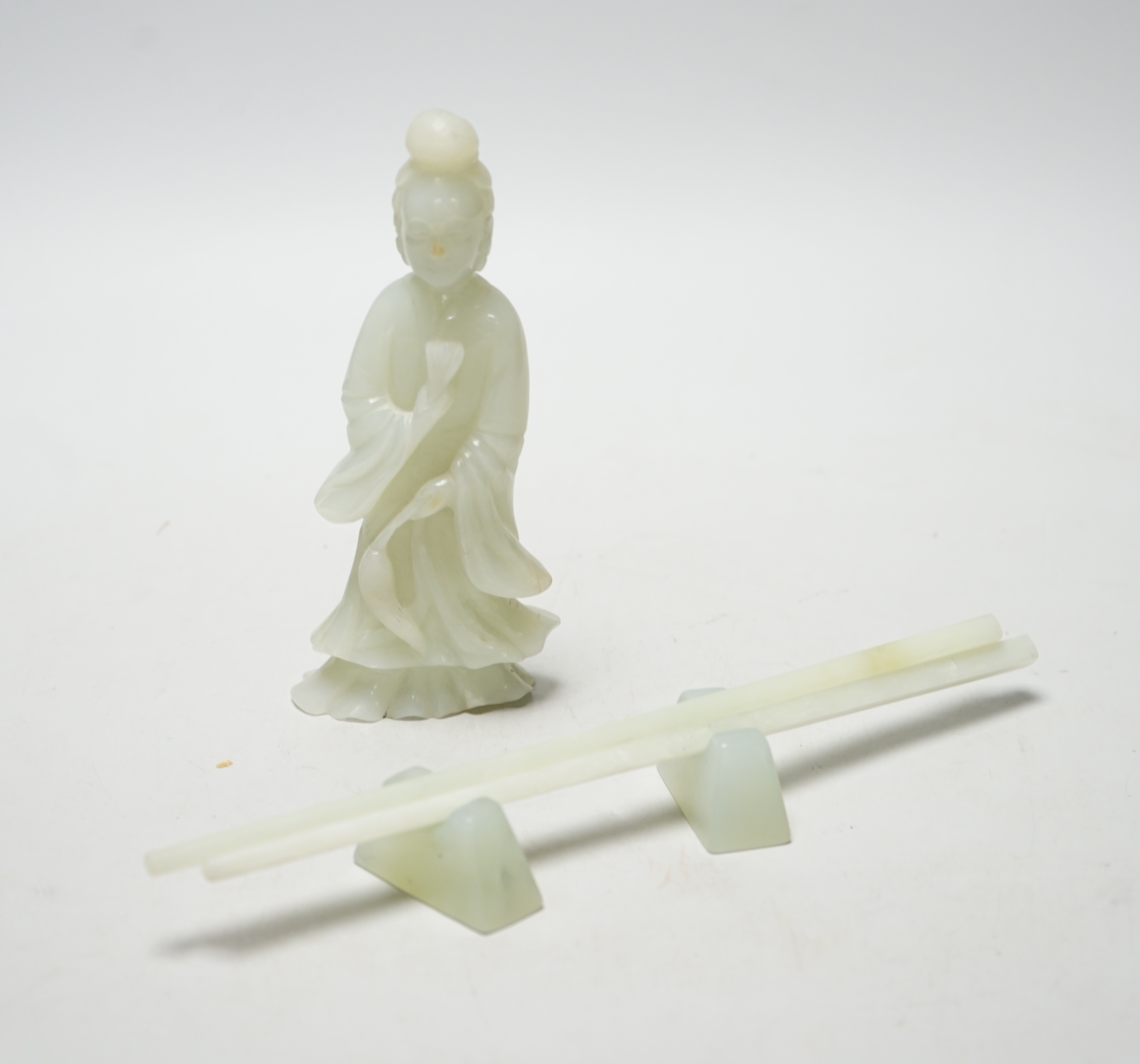 A Chinese pale celadon jade lady and a pair of bowenite jade chopsticks on stand, largest 23cm in length                                                                                                                    