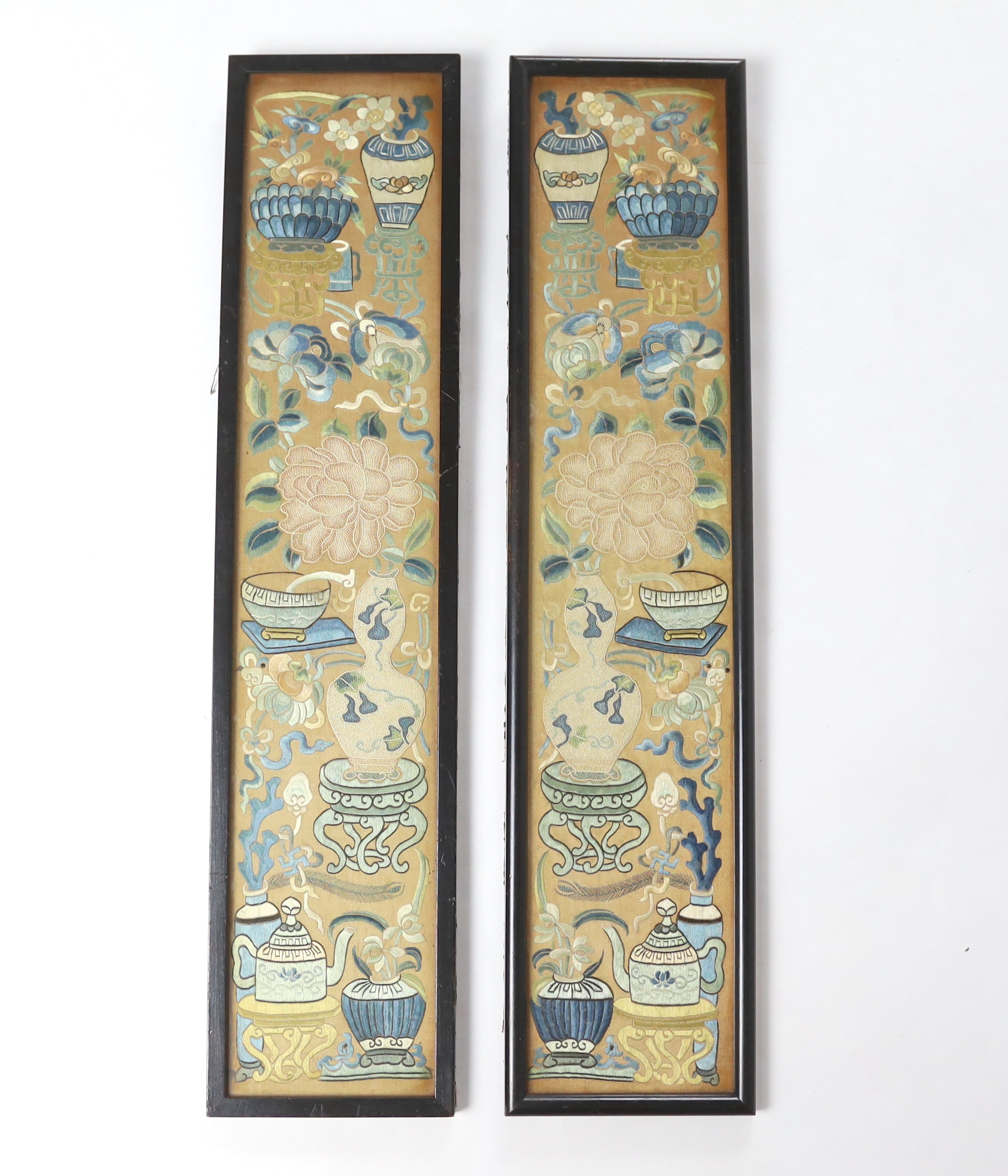 A pair of late 19th century / early 20th century Chinese silk embroidered sleeve bands, embroidered mostly with Chinese knot and stem stitch with unusual auspicious symbols each, 9.5cm wide x 49.5cm high (framed separate