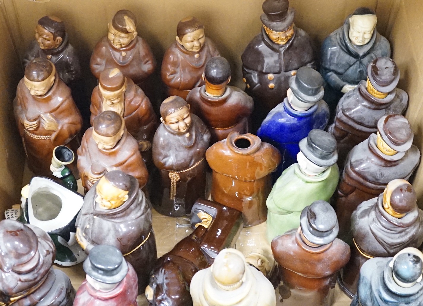 A group of twenty three Doulton ‘style’ figural spirit flasks and a jug                                                                                                                                                     