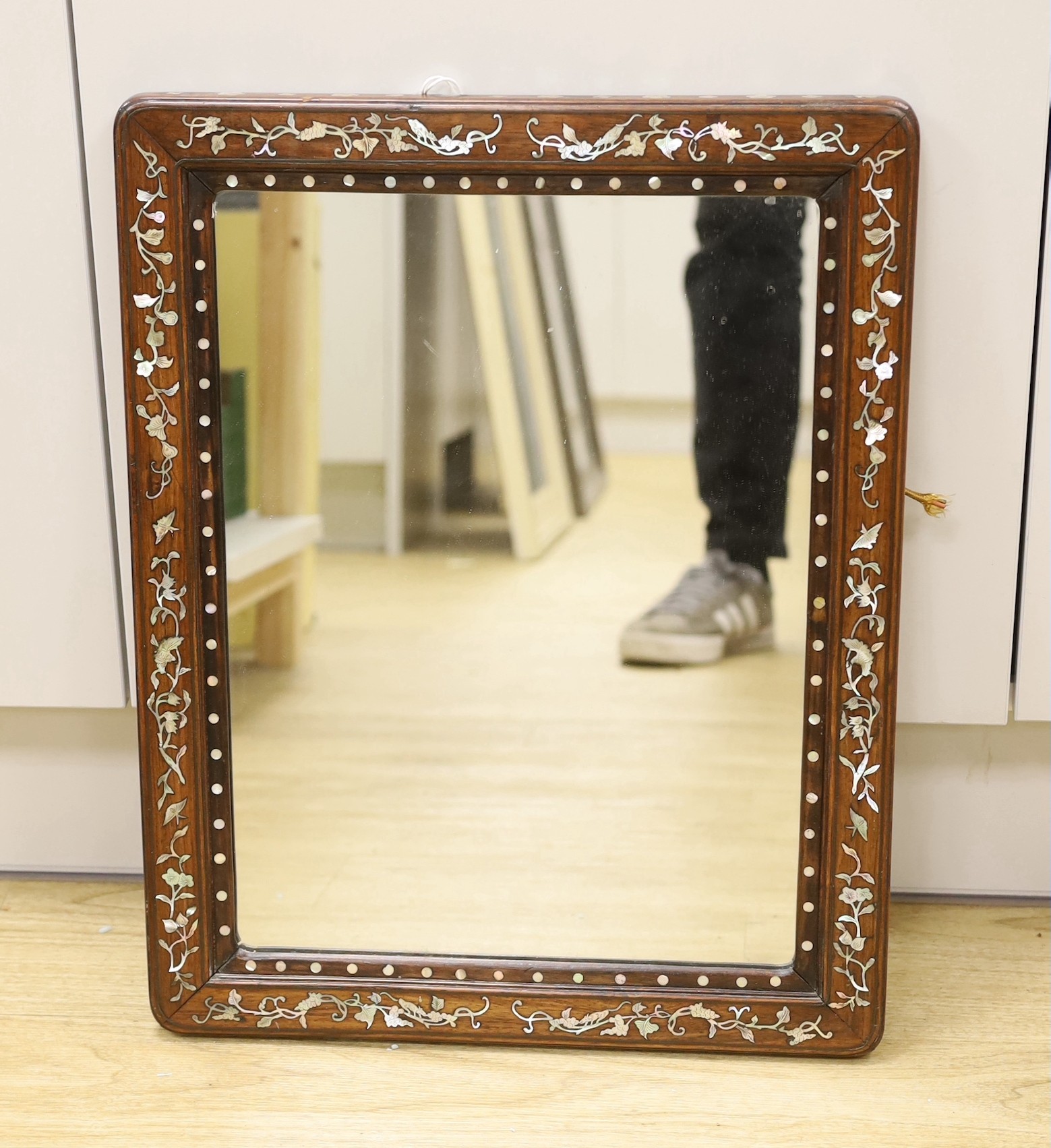 A Chinese mother of pearl inlaid hongmu rectangular mirror, 41cms wide x 52cms high                                                                                                                                         